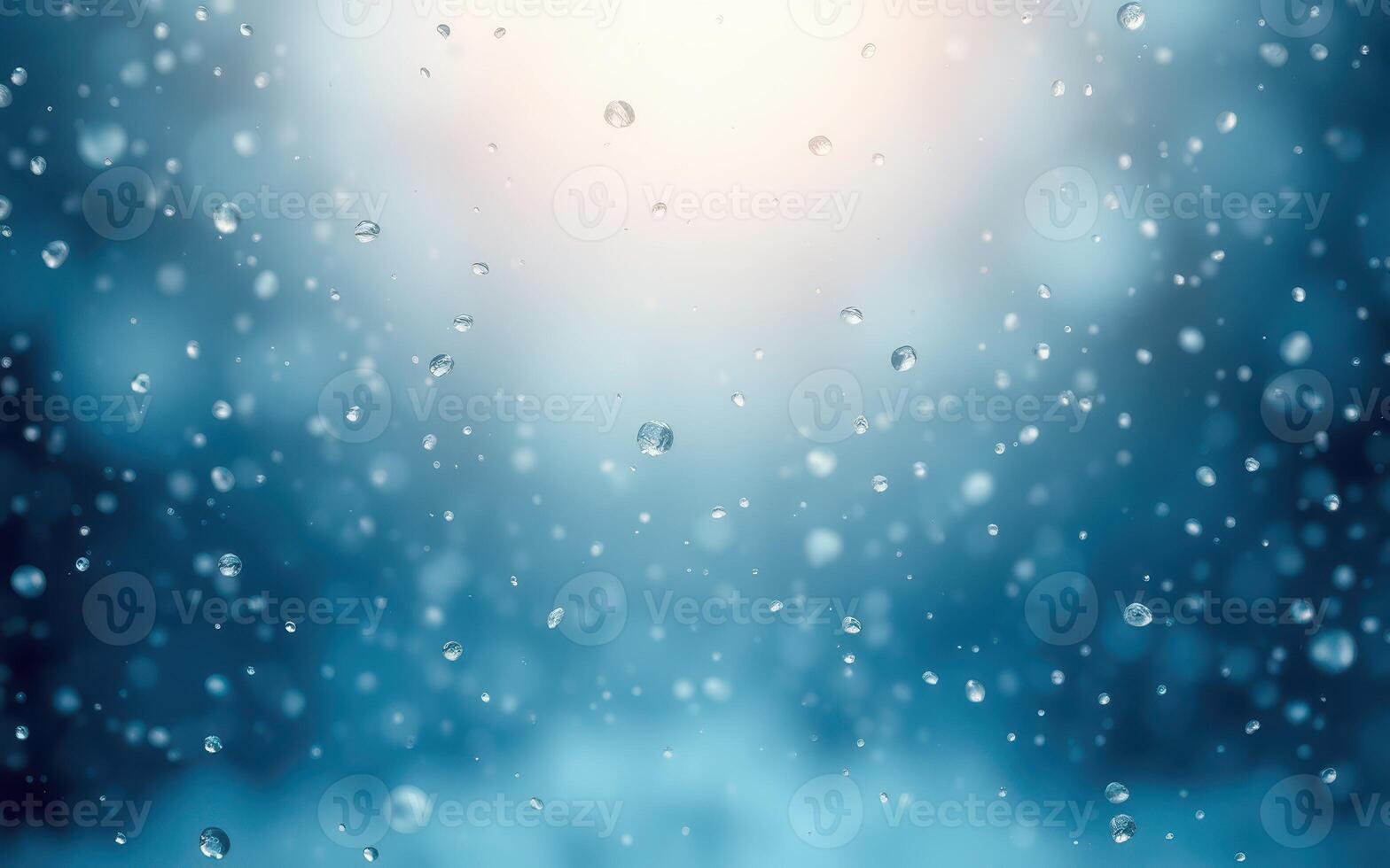 Raindrops cascade gently in a serene, illuminated atmosphere during a tranquil evening photo