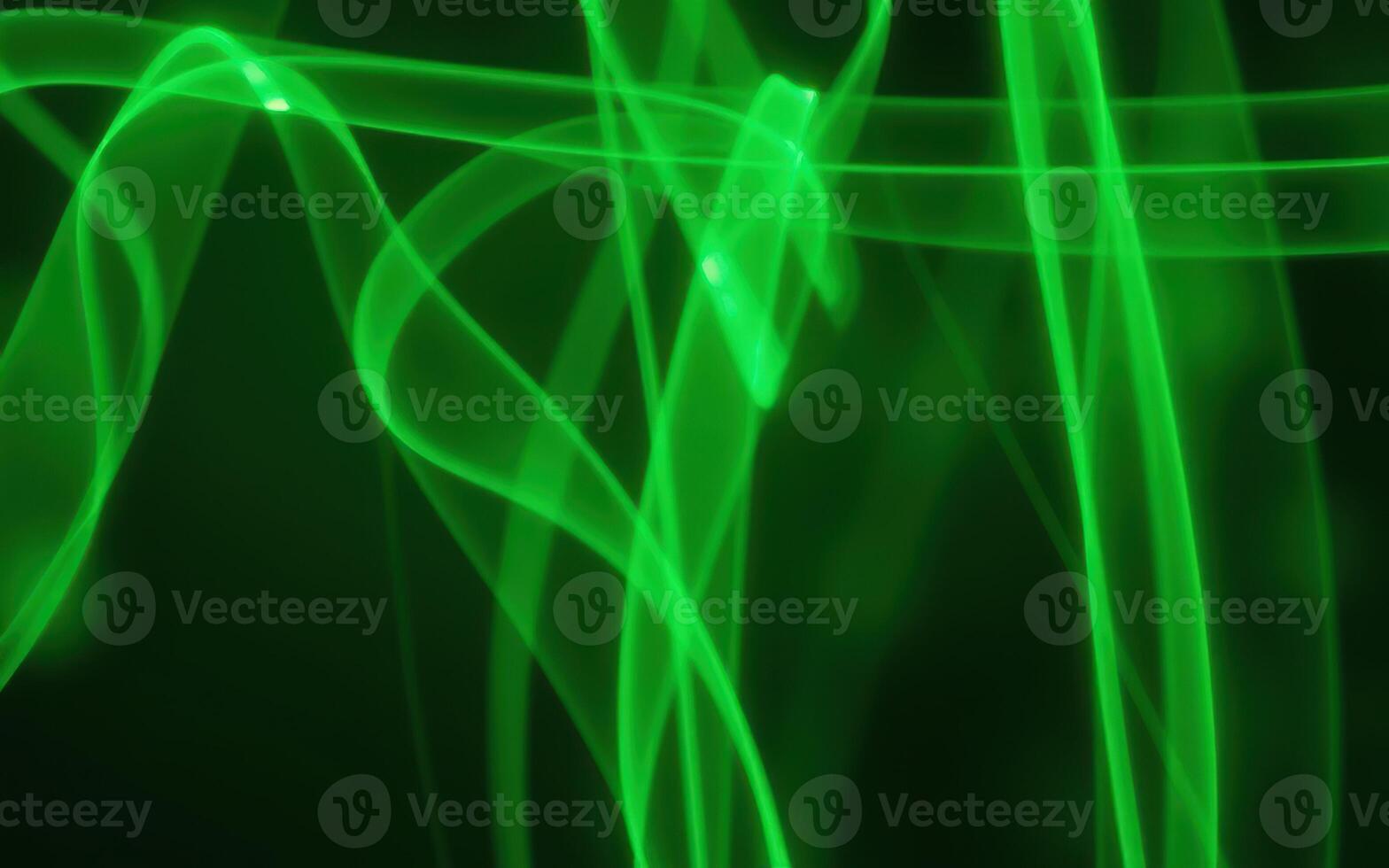 Swirling green patterns create an abstract visual effect against a dark background in this vibrant display of light and color photo