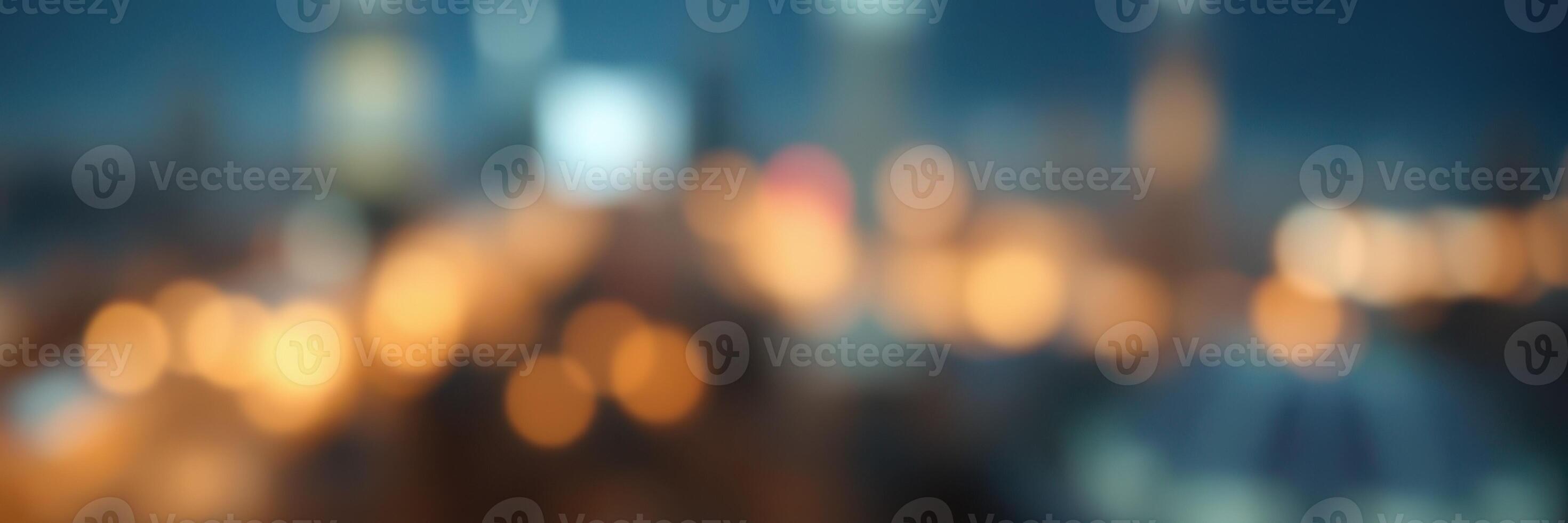 City lights sparkle under twilight sky, creating a vibrant atmosphere with blurred urban landscape photo