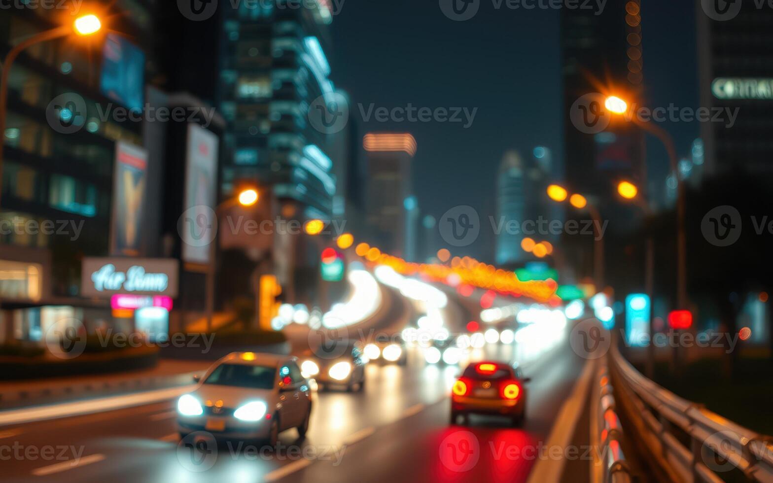 Nighttime city traffic on a busy road illuminated by urban lights and blurred movement photo