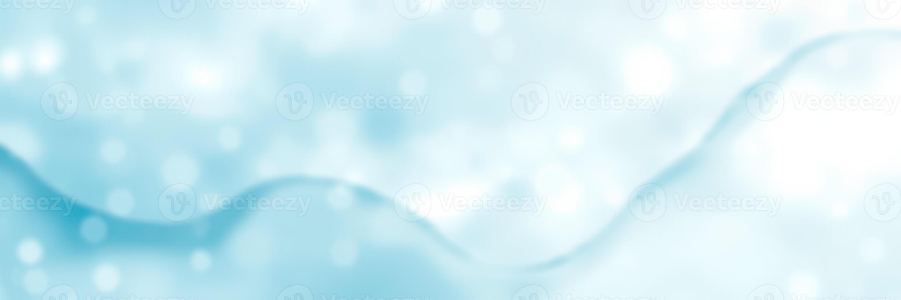 Soft blue waves create a serene atmosphere with gentle ripples and bokeh effects during daytime in a peaceful setting photo