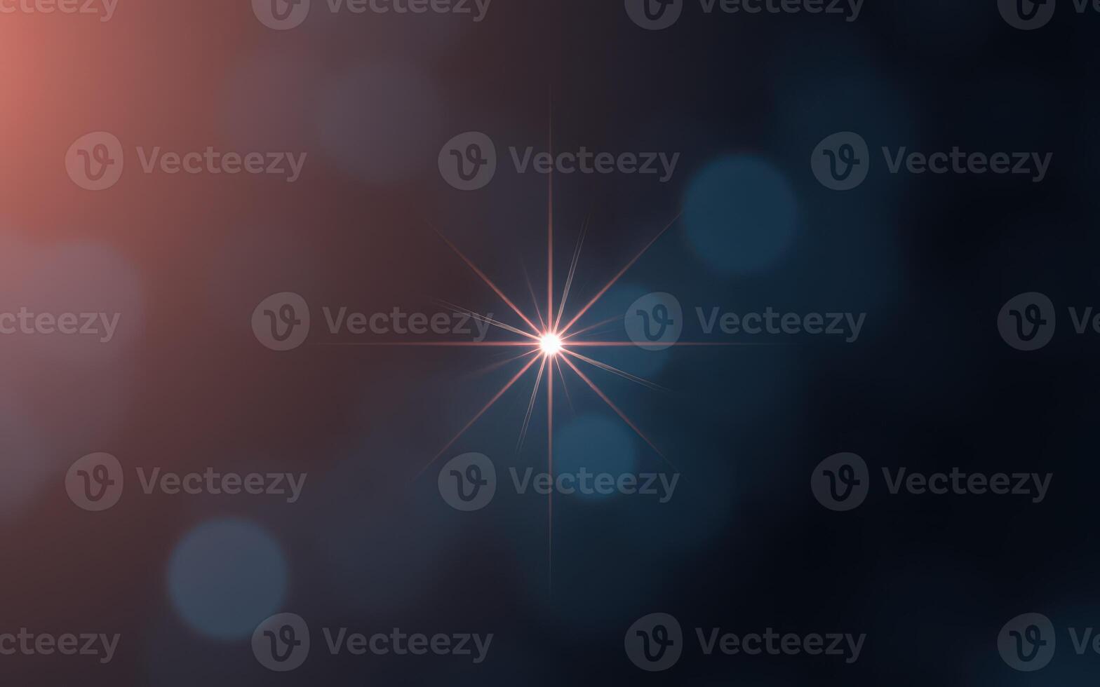 Sparkling light surrounded by soft glowing bokeh in a dark atmosphere at night photo