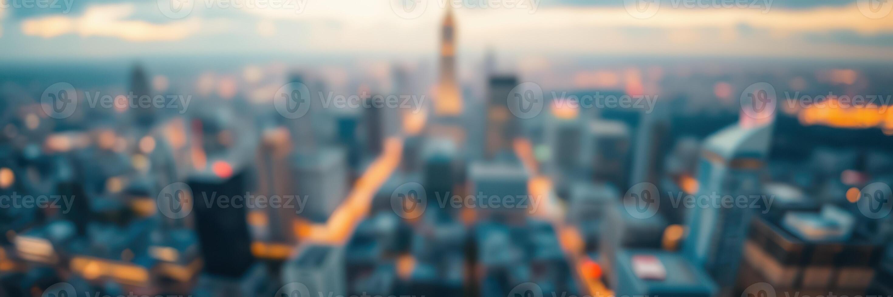 City skyline at twilight capturing the glow of lights against a blurred backdrop of buildings and a fading sunset photo