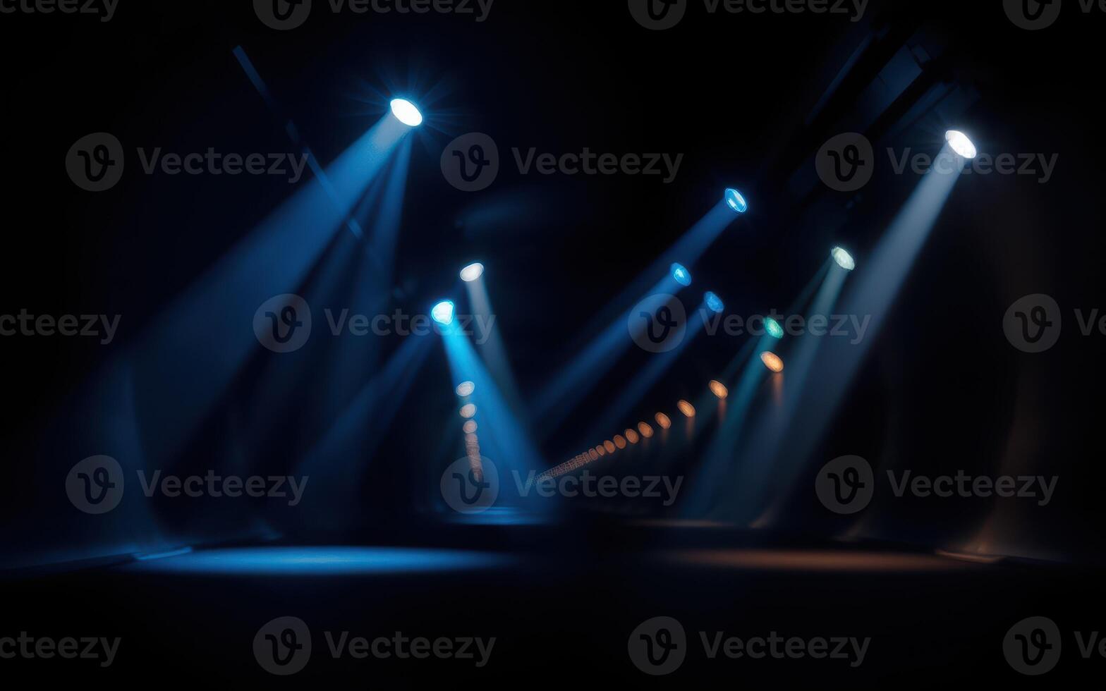 Bright beams of light illuminate a dark corridor with a mysterious atmosphere during a nighttime event photo