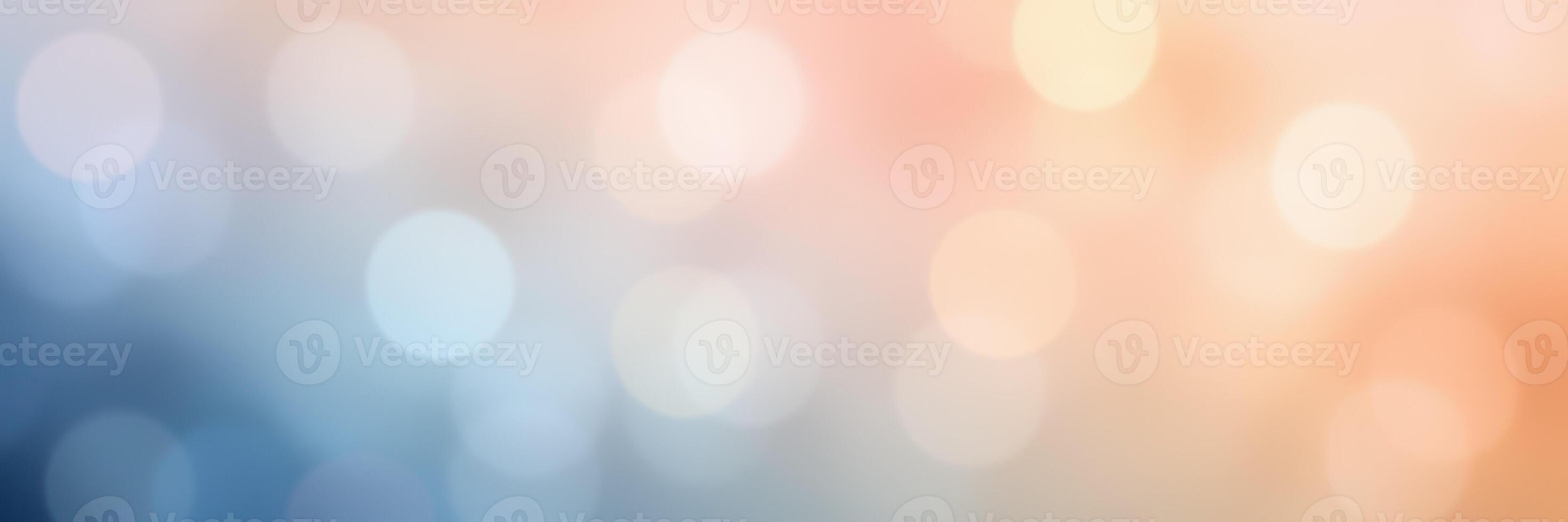 Smooth gradient of soft bokeh lights in blue and peach hues creates a tranquil atmosphere for artistic projects photo