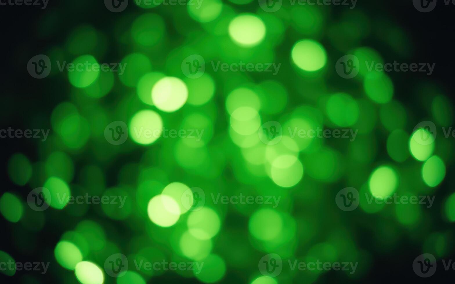 Lush green bokeh lights creating a vibrant and calming atmosphere at a festive outdoor gathering in the evening photo