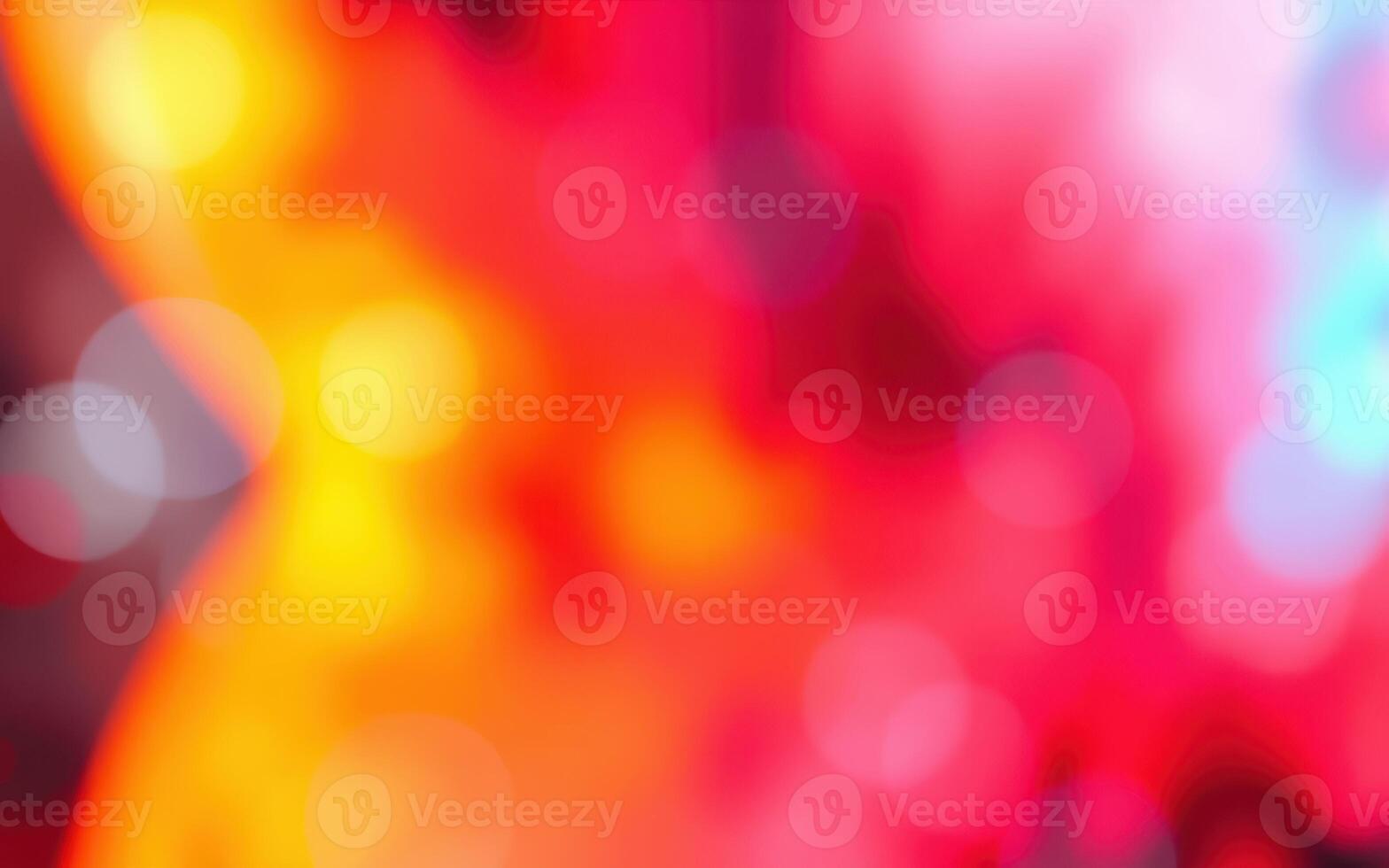 Colorful abstract background featuring vibrant red, yellow, and orange hues with soft bokeh effects creating a dynamic visual atmosphere photo