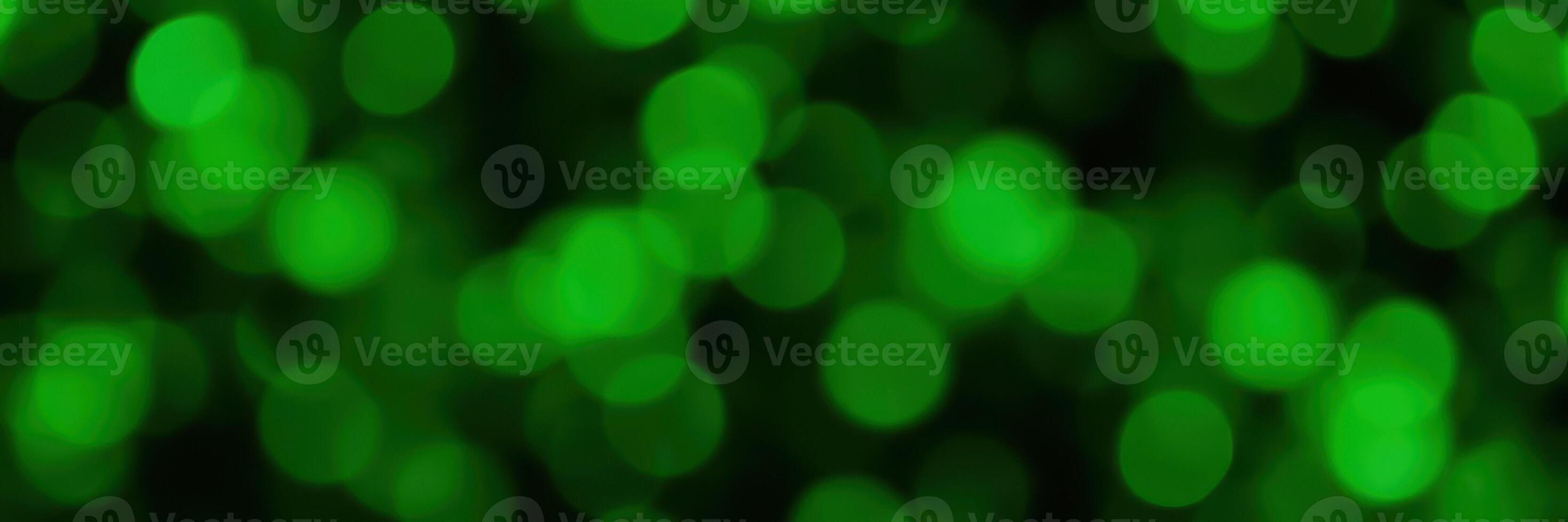 Green bokeh lights create a dreamy atmosphere during a nighttime event in an urban setting photo