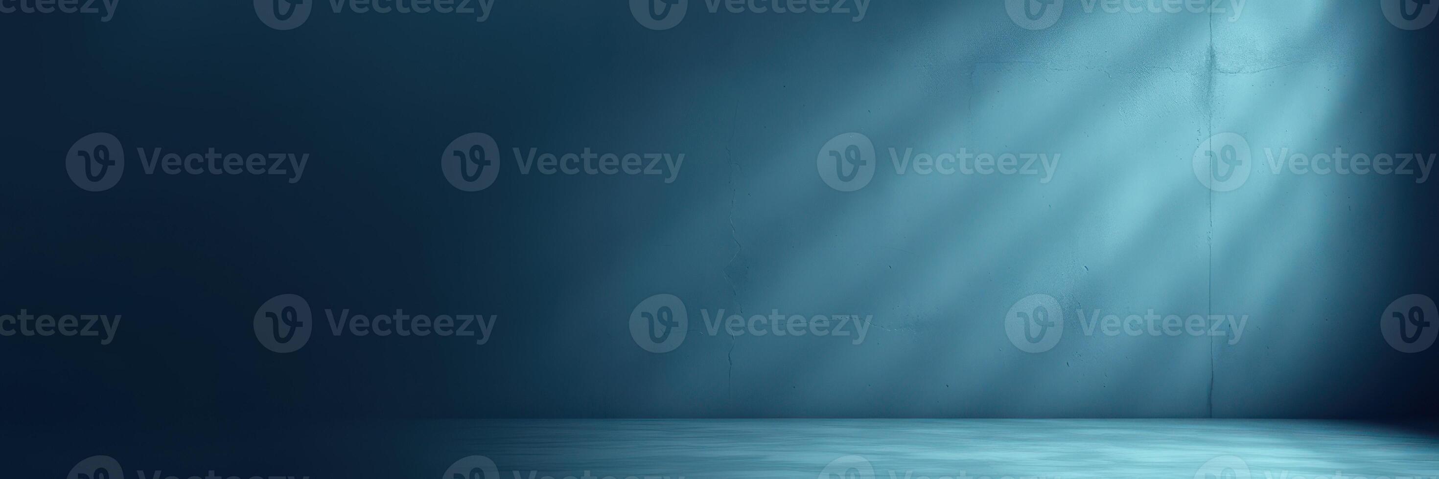 Soft blue light illuminates an empty stage in a darkened room, creating a serene atmosphere for performance or presentation photo