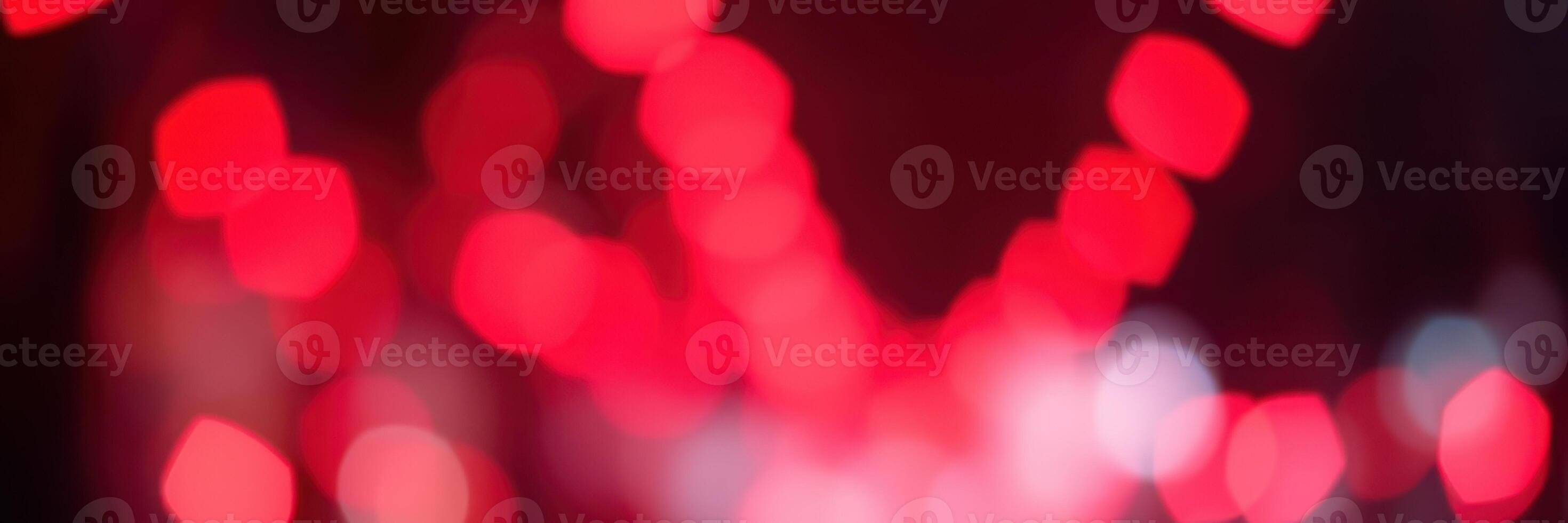 Vibrant red bokeh lights create a festive atmosphere during the celebration in a dynamic city setting at night photo