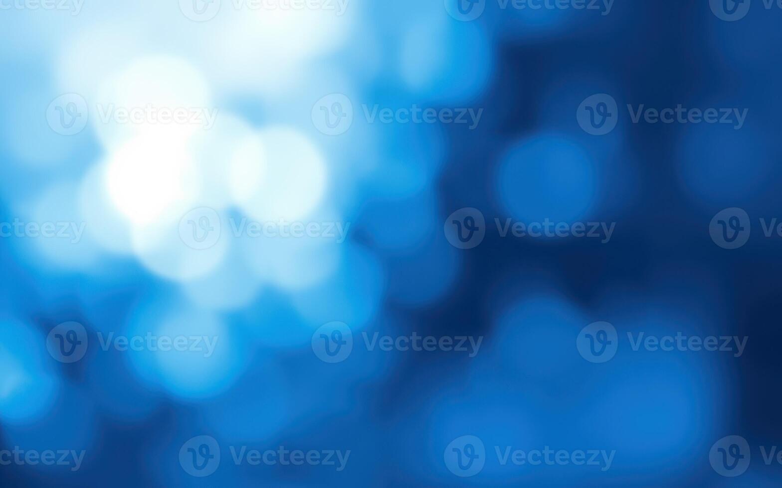 Abstract blue bokeh effect created by soft light patterns in a blurred background photo