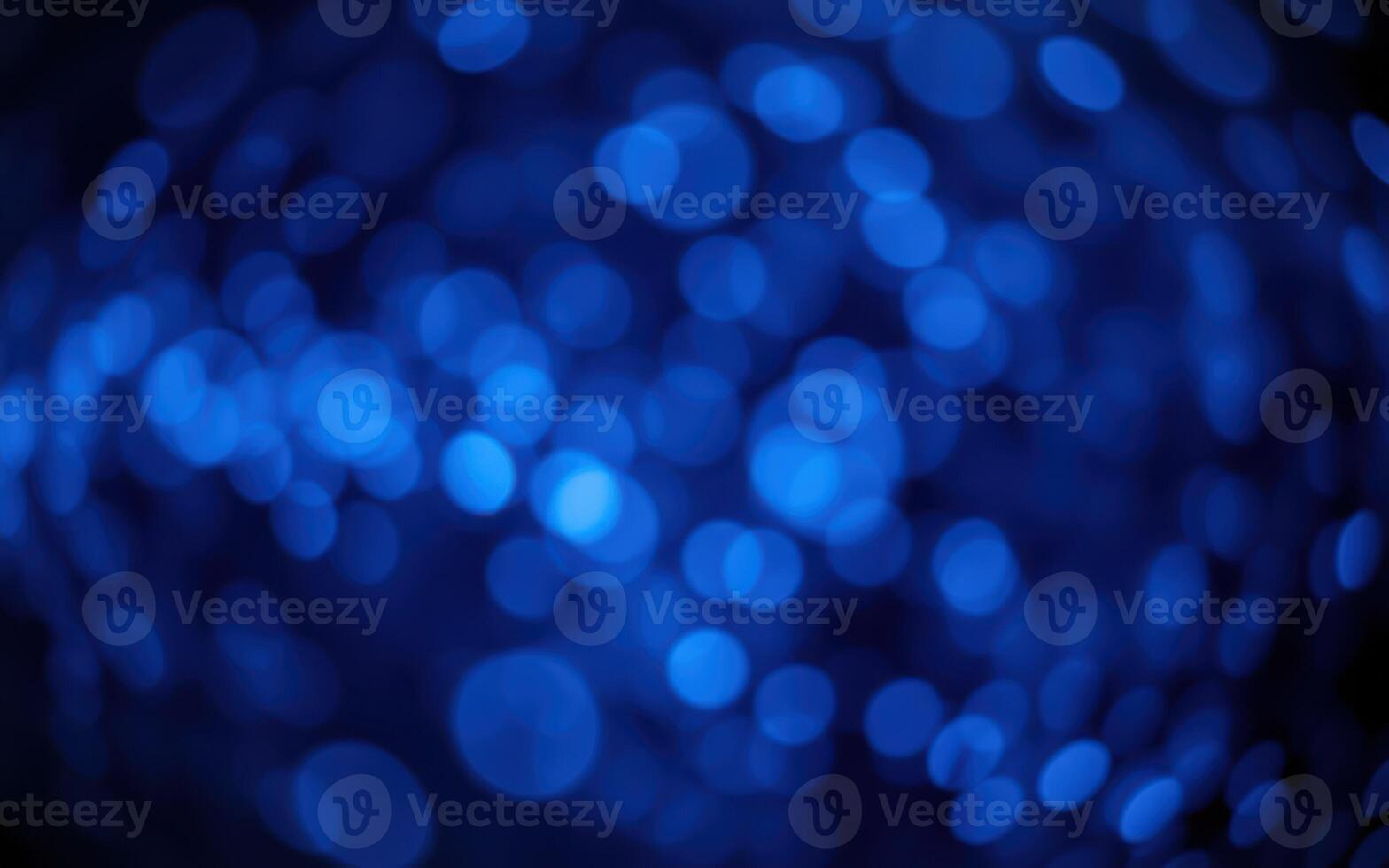 Vibrant blue bokeh lights create an enchanting abstract backdrop for evening celebrations photo