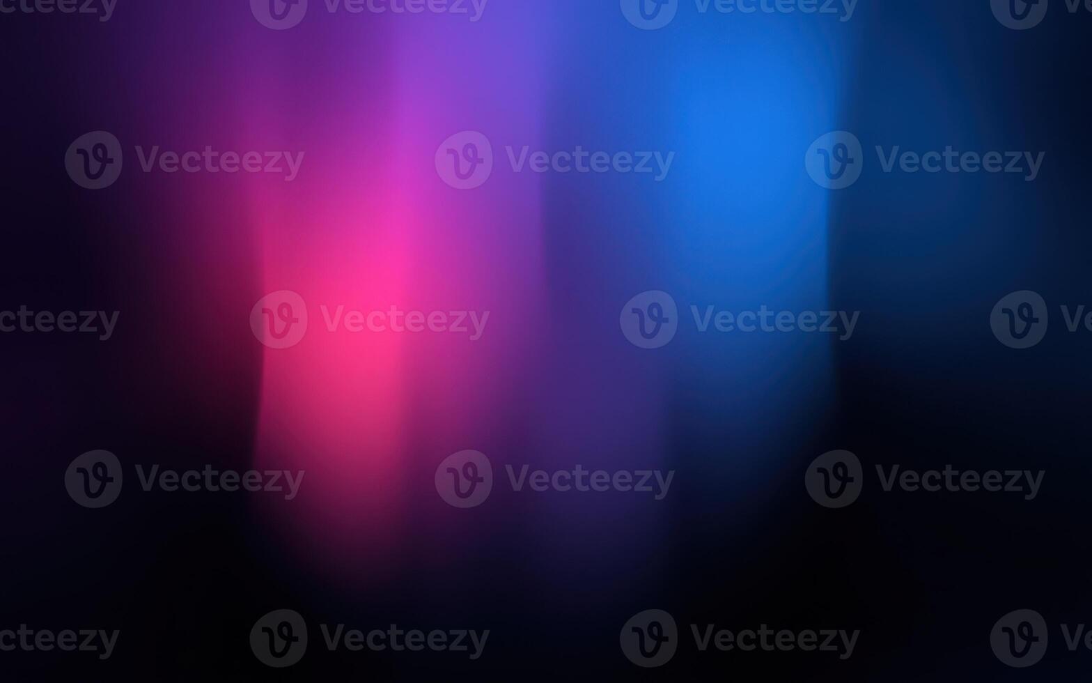 Vibrant swirling colors blend in abstract patterns creating a captivating visual experience at night photo