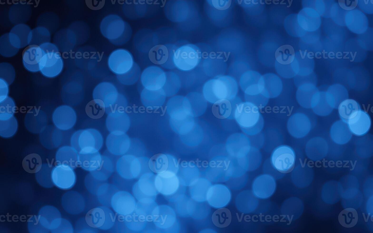 Vivid blue bokeh lights create a mesmerizing background for artistic projects and digital designs photo