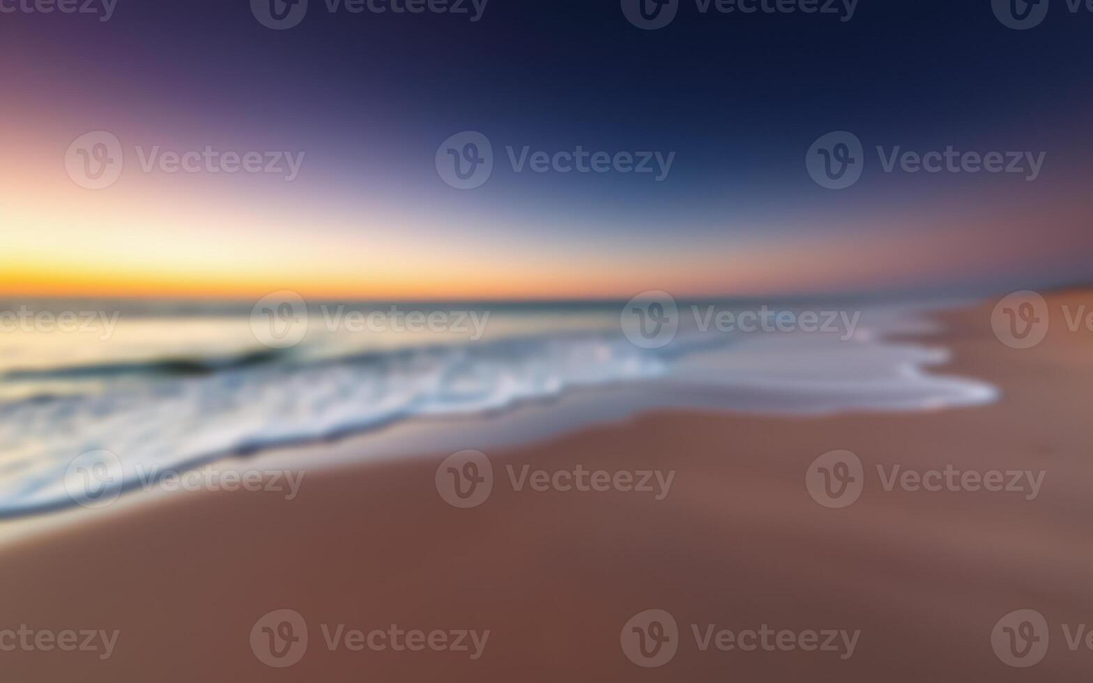Vibrant sunset over a tranquil beach with gentle waves lapping at the shore photo