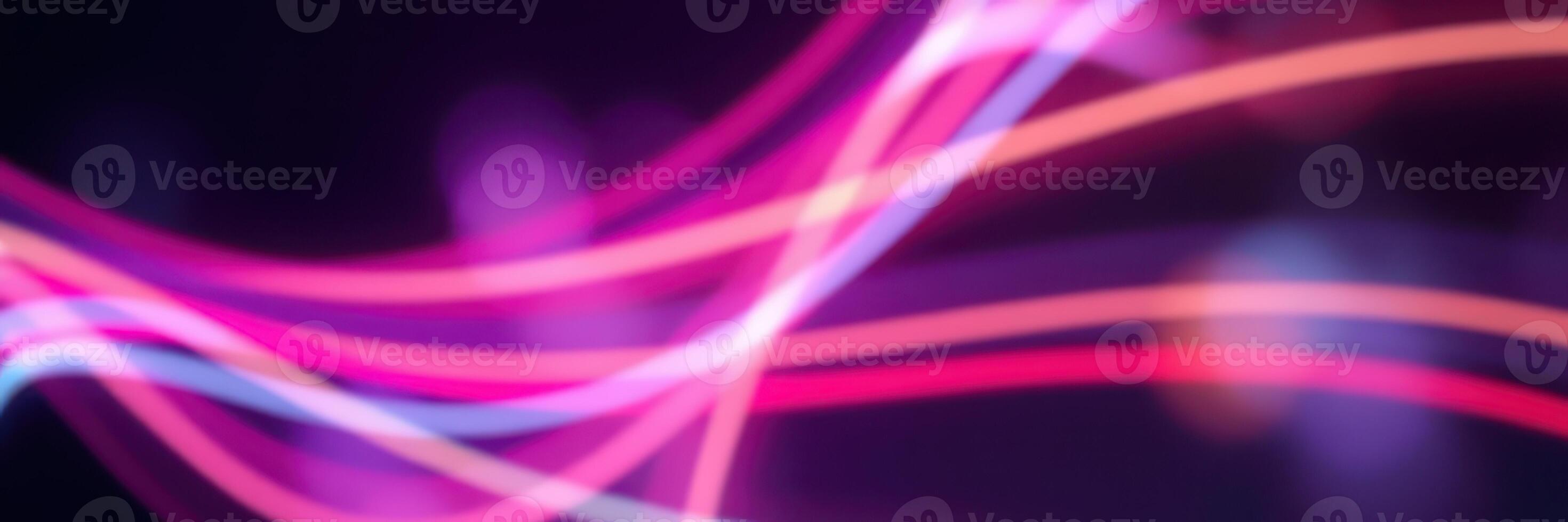 Colorful abstract light trails create a dynamic atmosphere with vibrant energy at night photo