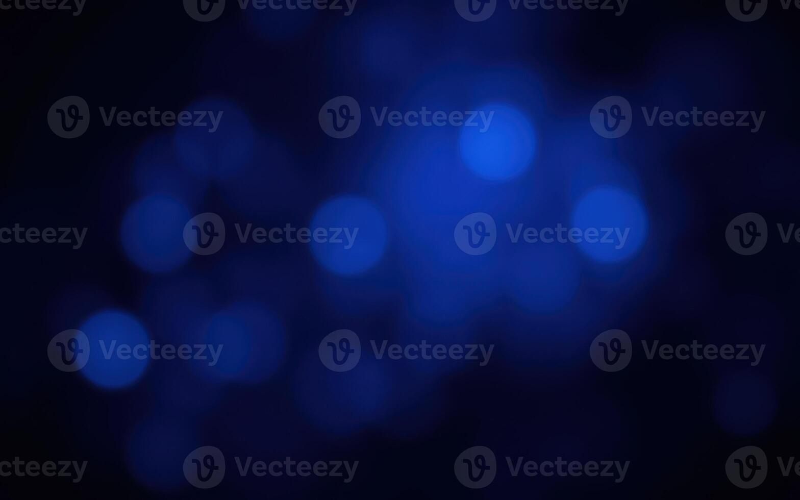 Abstract blue bokeh background with varying light intensity and softness creating a dreamy atmosphere photo