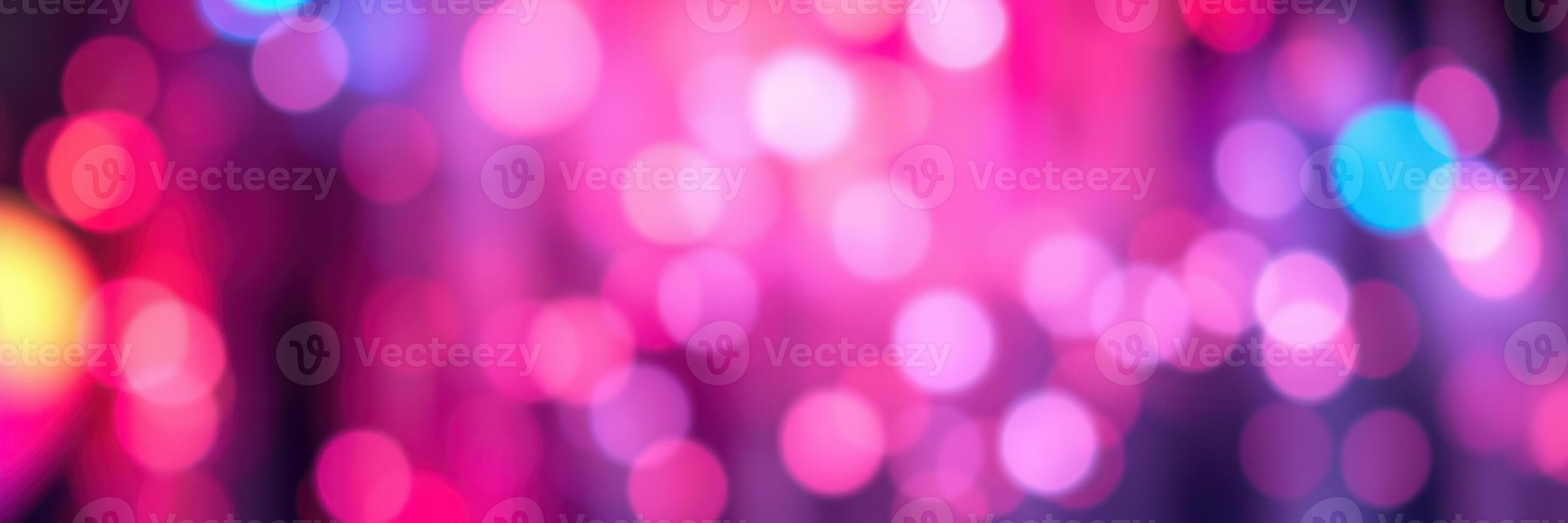 Colorful bokeh lights create a festive atmosphere during a night celebration in a vibrant urban setting photo