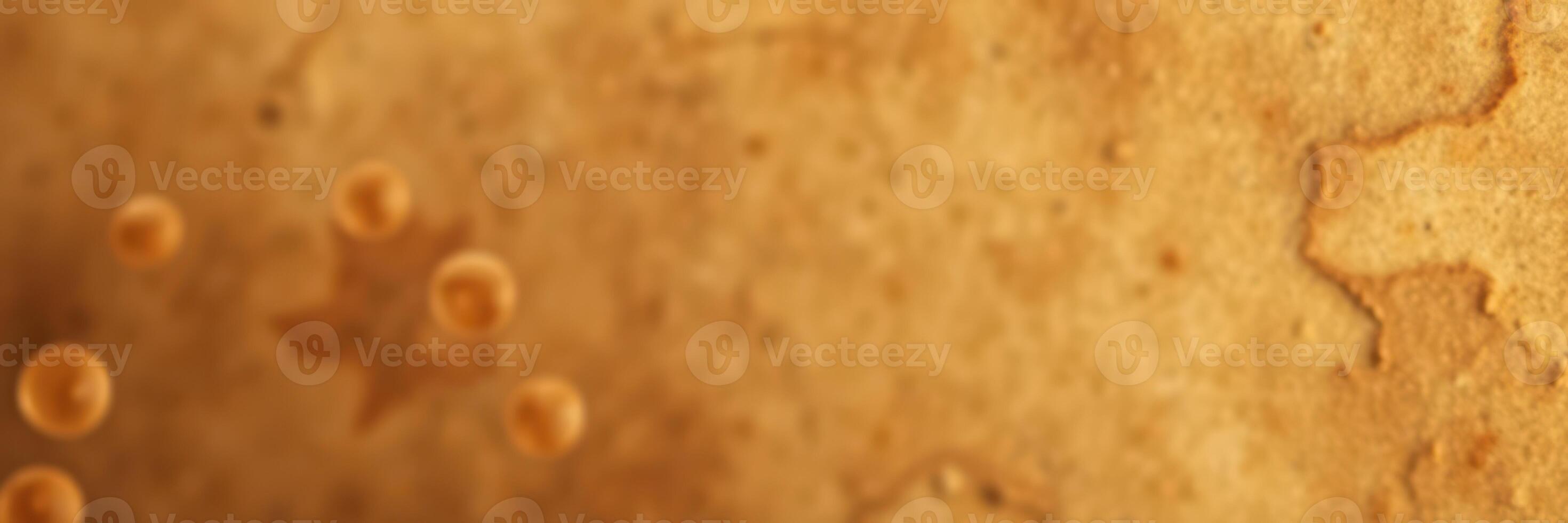 Bubbles rising in amber liquid during a close-up observation at a warm setting photo