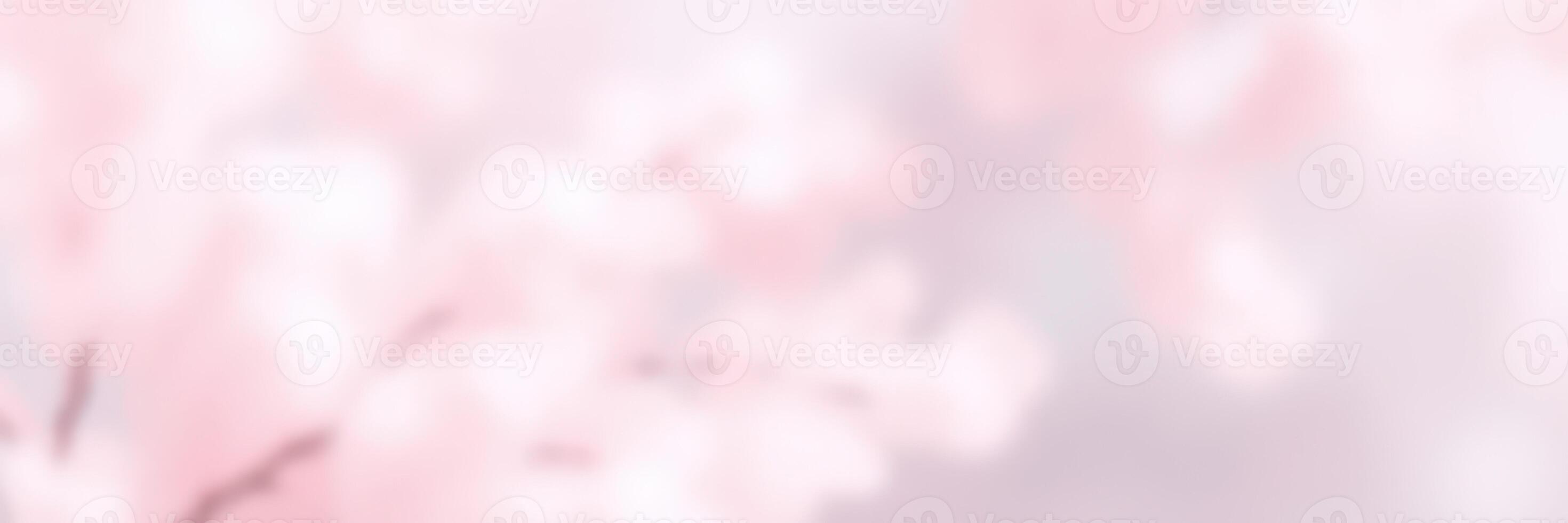 Blossom branches sway gently in the warm spring breeze under the clear blue sky adorned with cherry blossoms photo