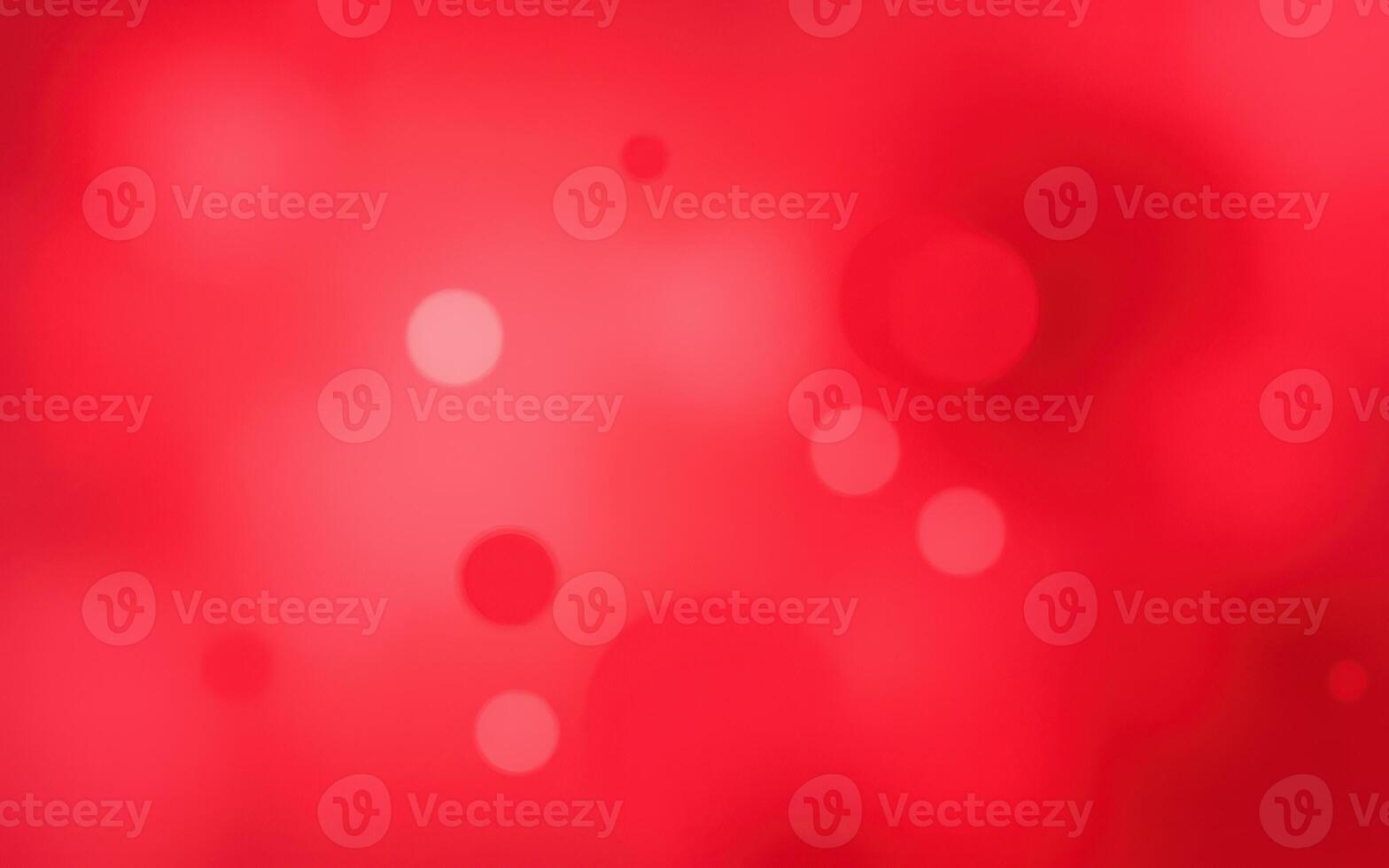 Vibrant abstract background with shades of red and soft circular patterns creating depth and texture photo