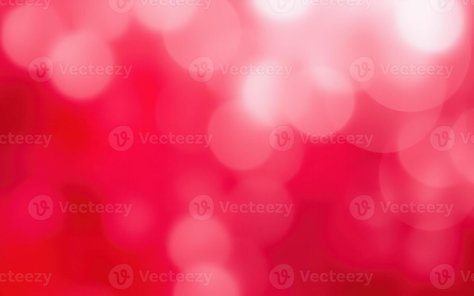 Colorful bokeh background with red and pink hues creating a soft, dreamy atmosphere for artistic projects photo