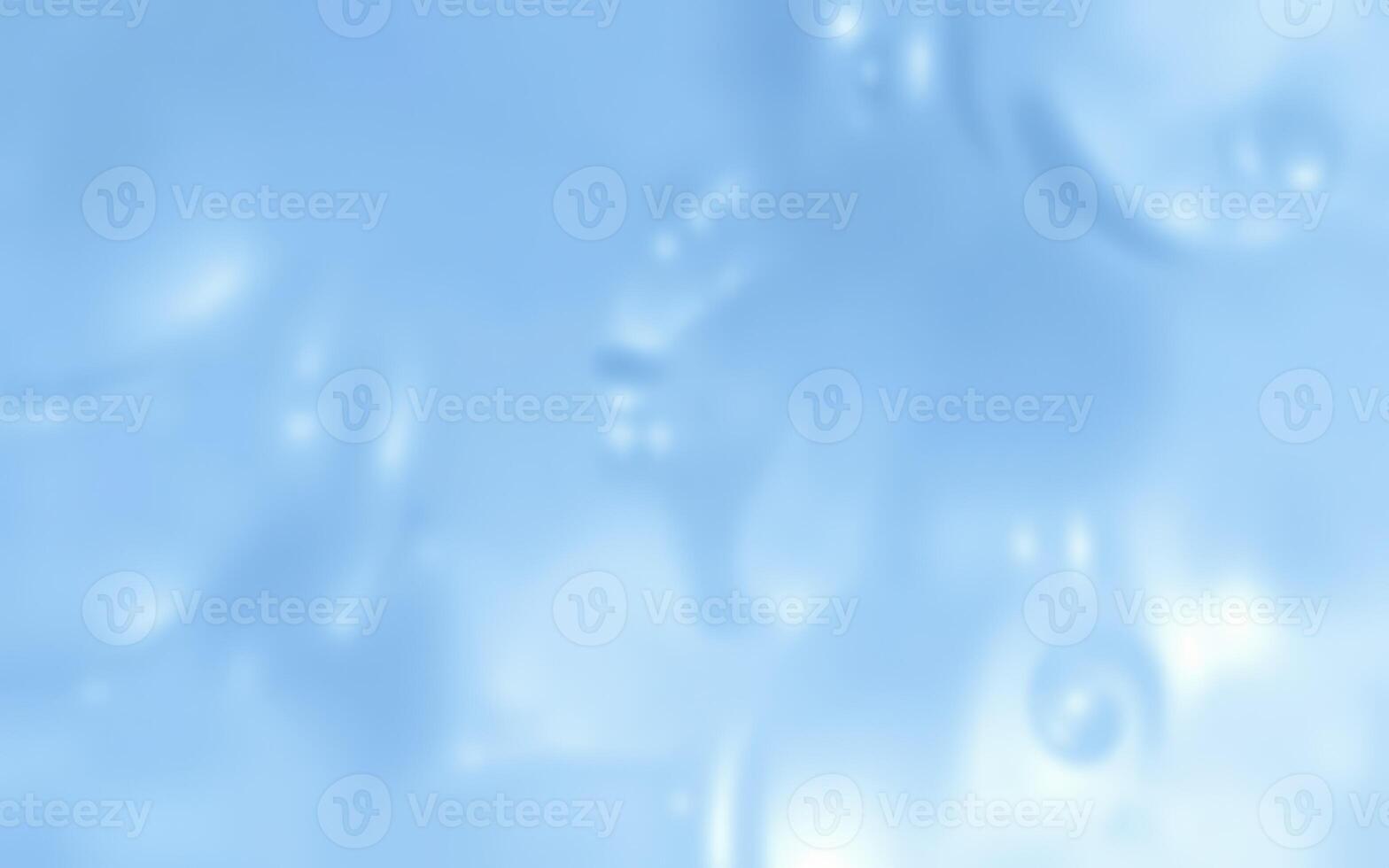 Bubbles floating in a soft blue background creating a calming and serene atmosphere indoors photo