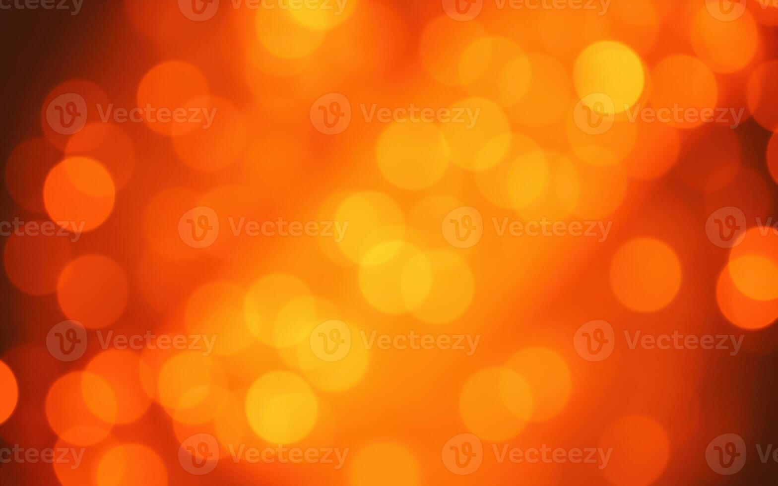 Warm orange bokeh lights create a cozy atmosphere for a celebration or gathering during the evening photo