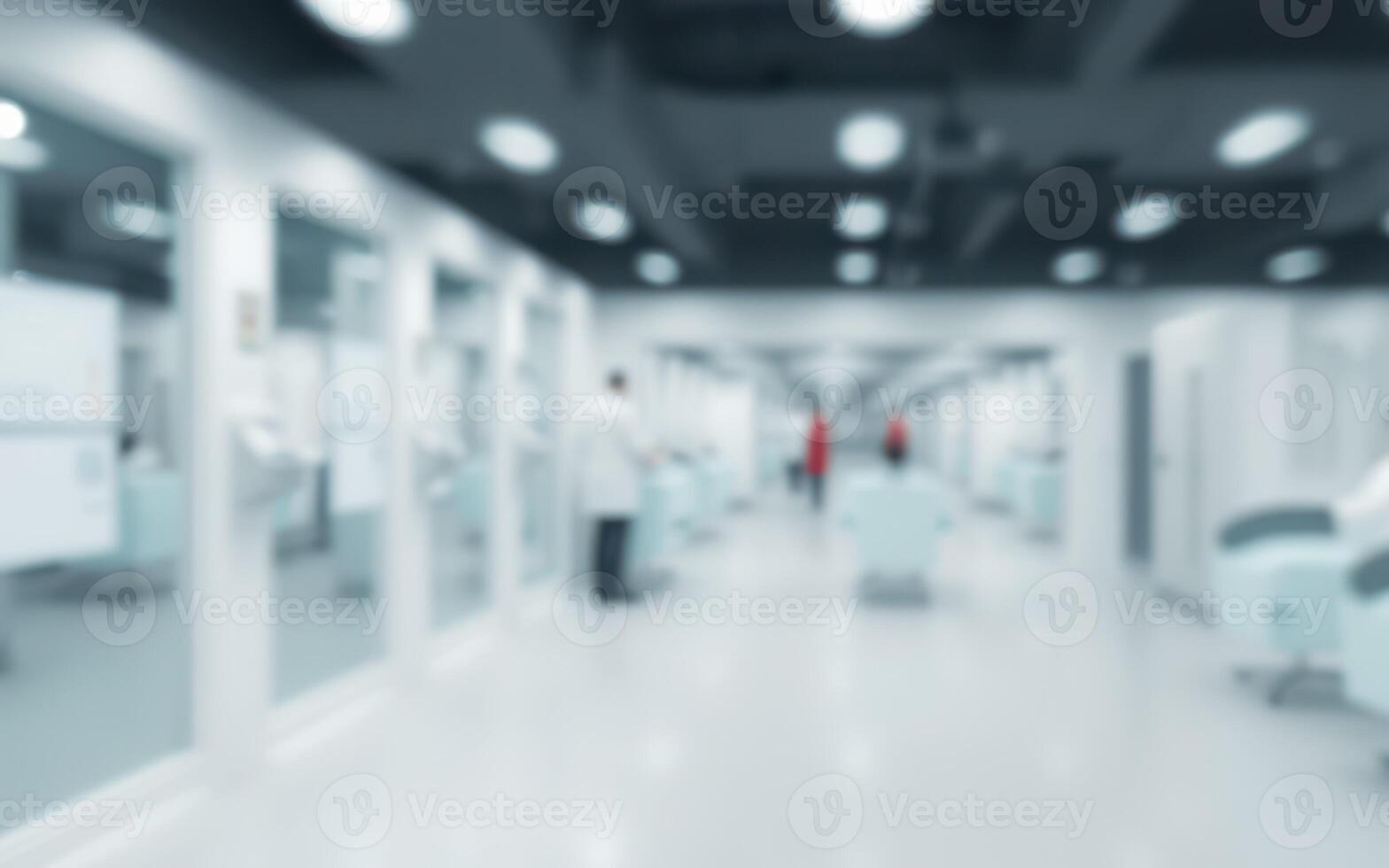 Healthcare professionals walking through a hospital corridor during a busy shift in the morning photo
