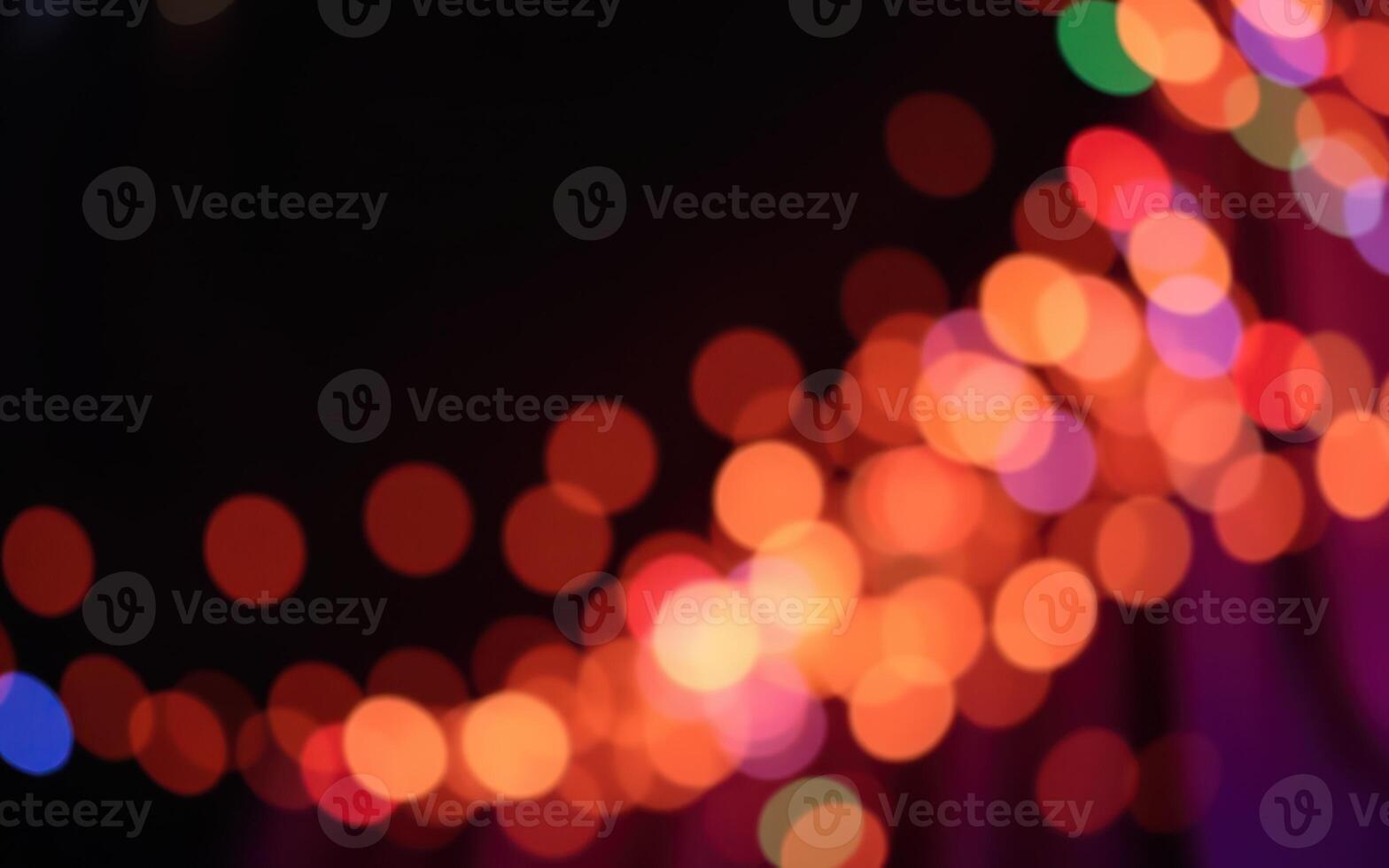 Vibrant bokeh lights create a festive atmosphere during a nighttime celebration in the city photo