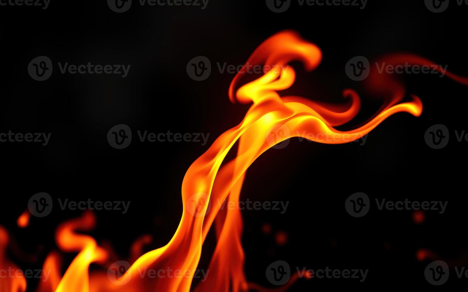 Flames dancing in the darkness, creating mesmerizing patterns and illuminating the area with a warm glow photo