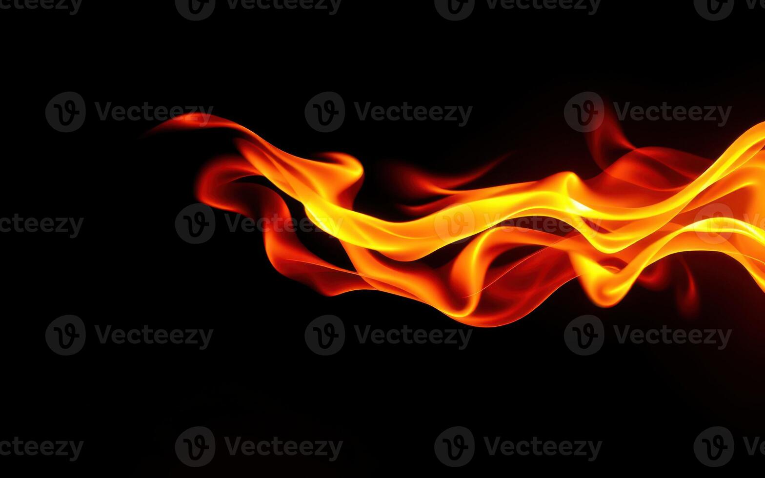 Flames dance gracefully in the darkness creating a striking visual display of fire and warmth photo