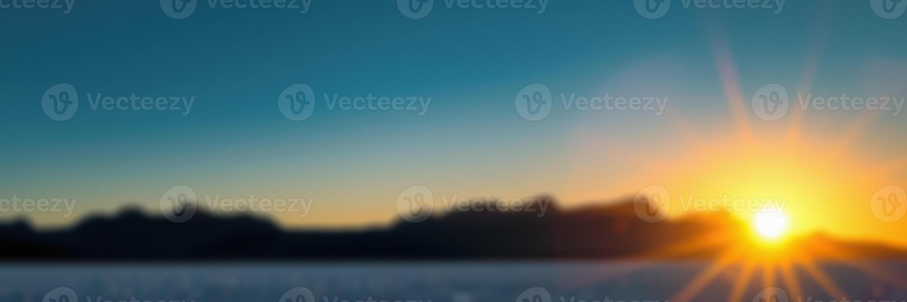 Sunrise over the mountains illuminating the serene landscape at dawn photo