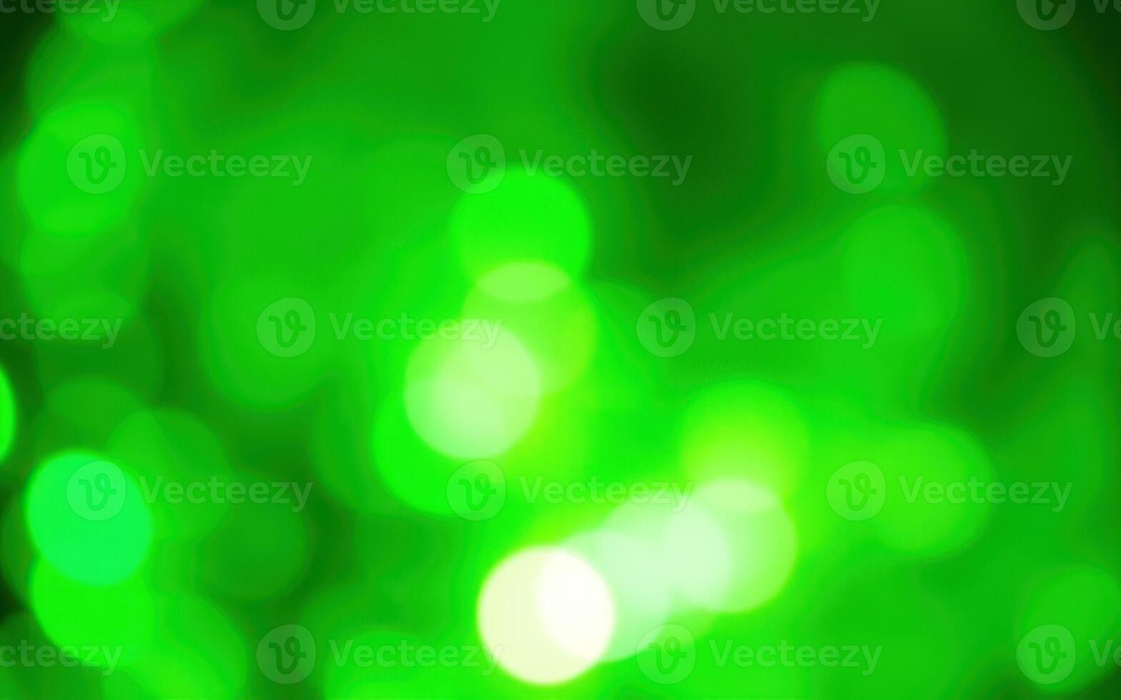 Vibrant green bokeh pattern creating a shimmering and lively background for various themes and designs photo