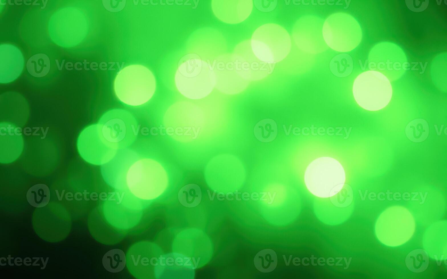 Vibrant green bokeh effect creating a magical atmosphere in a dimly lit space during a nighttime event photo