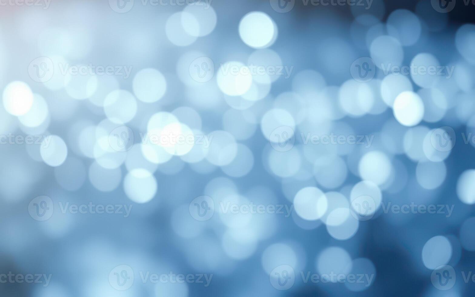 Soft blue bokeh background created by blurred lights in an abstract setting during a calm evening photo