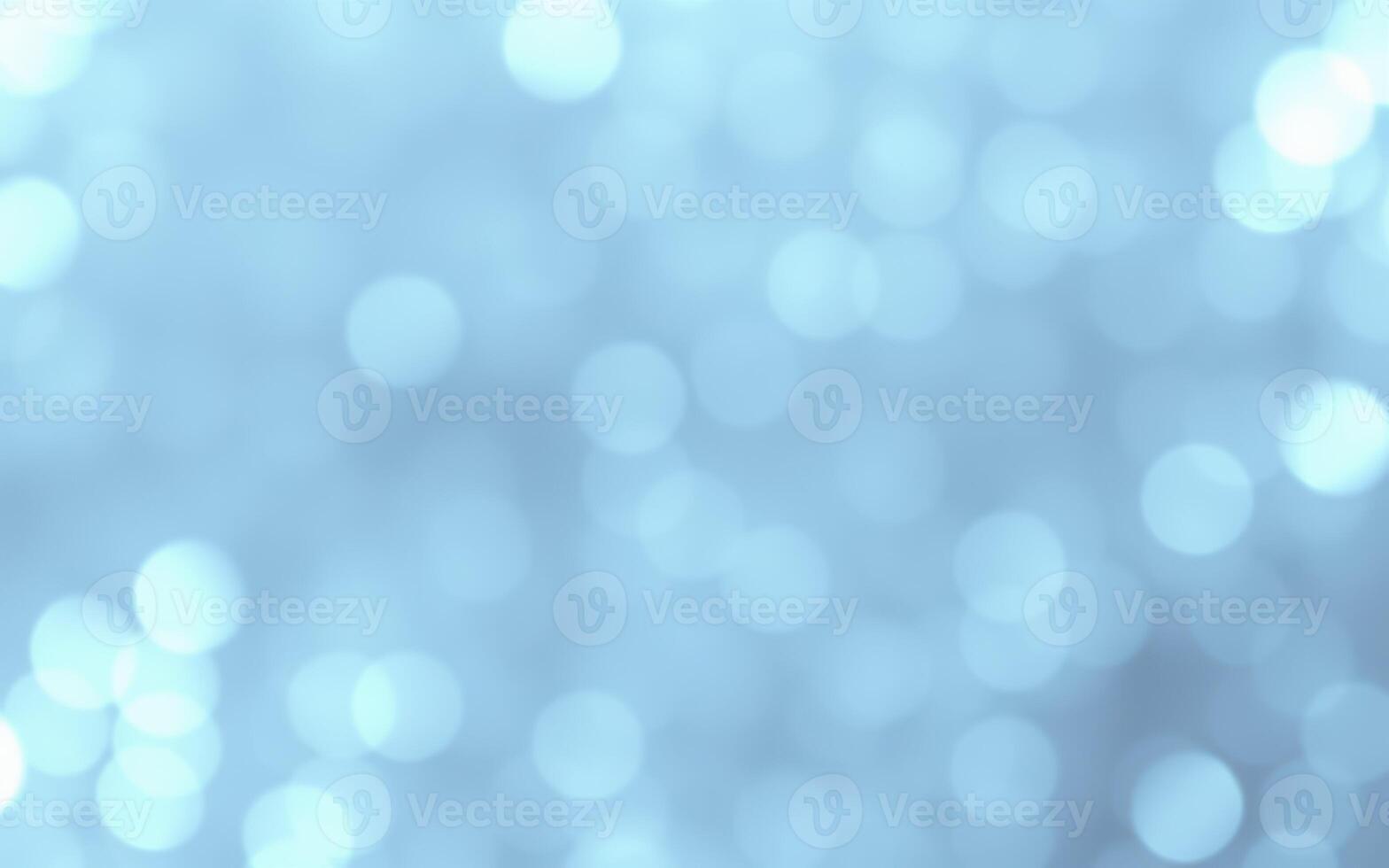 Soft blue bokeh lights create a serene atmosphere in a tranquil setting during early evening hours photo