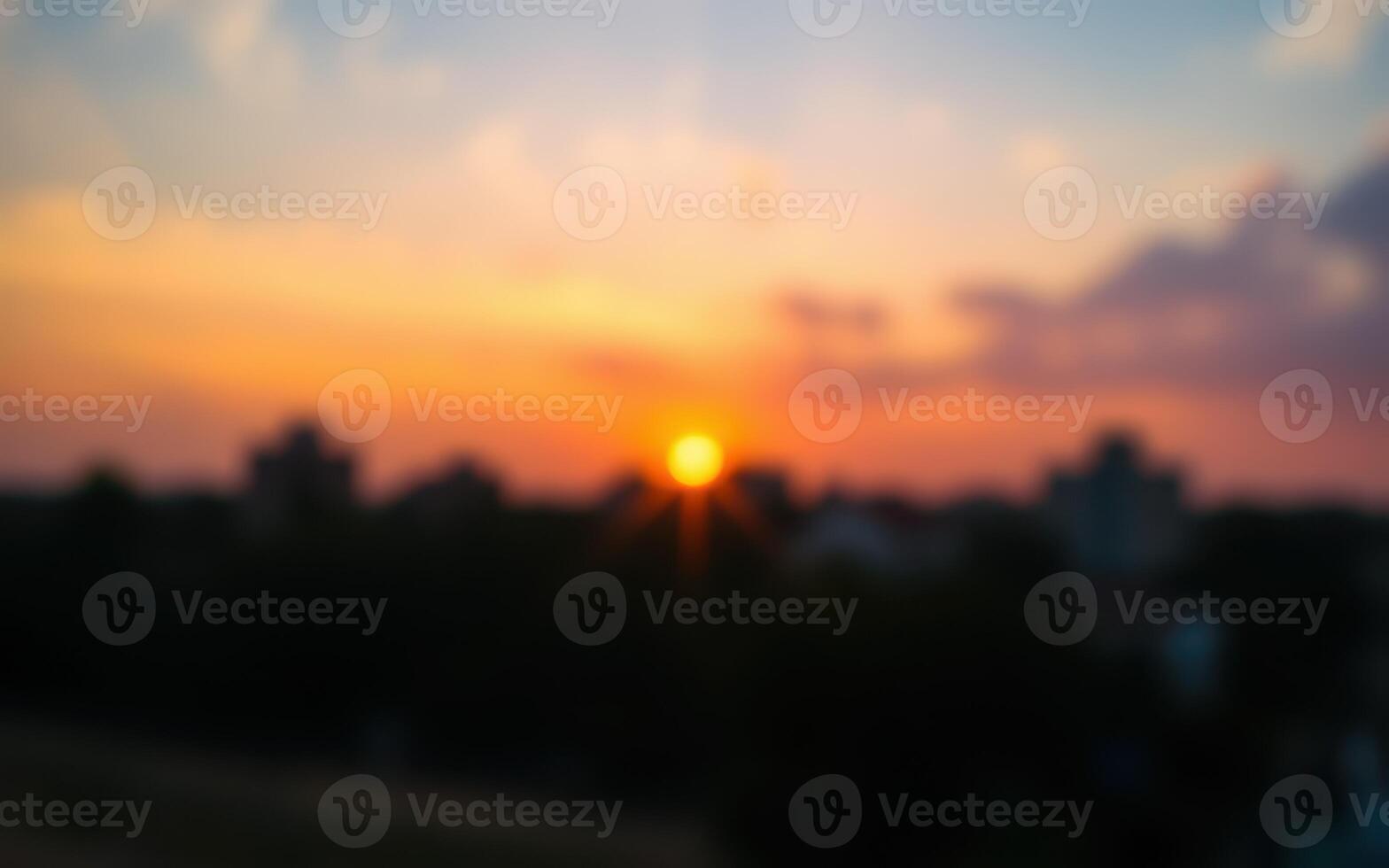 Beautiful sunset over city skyline with blurred focus capturing the vibrant colors of twilight sky photo