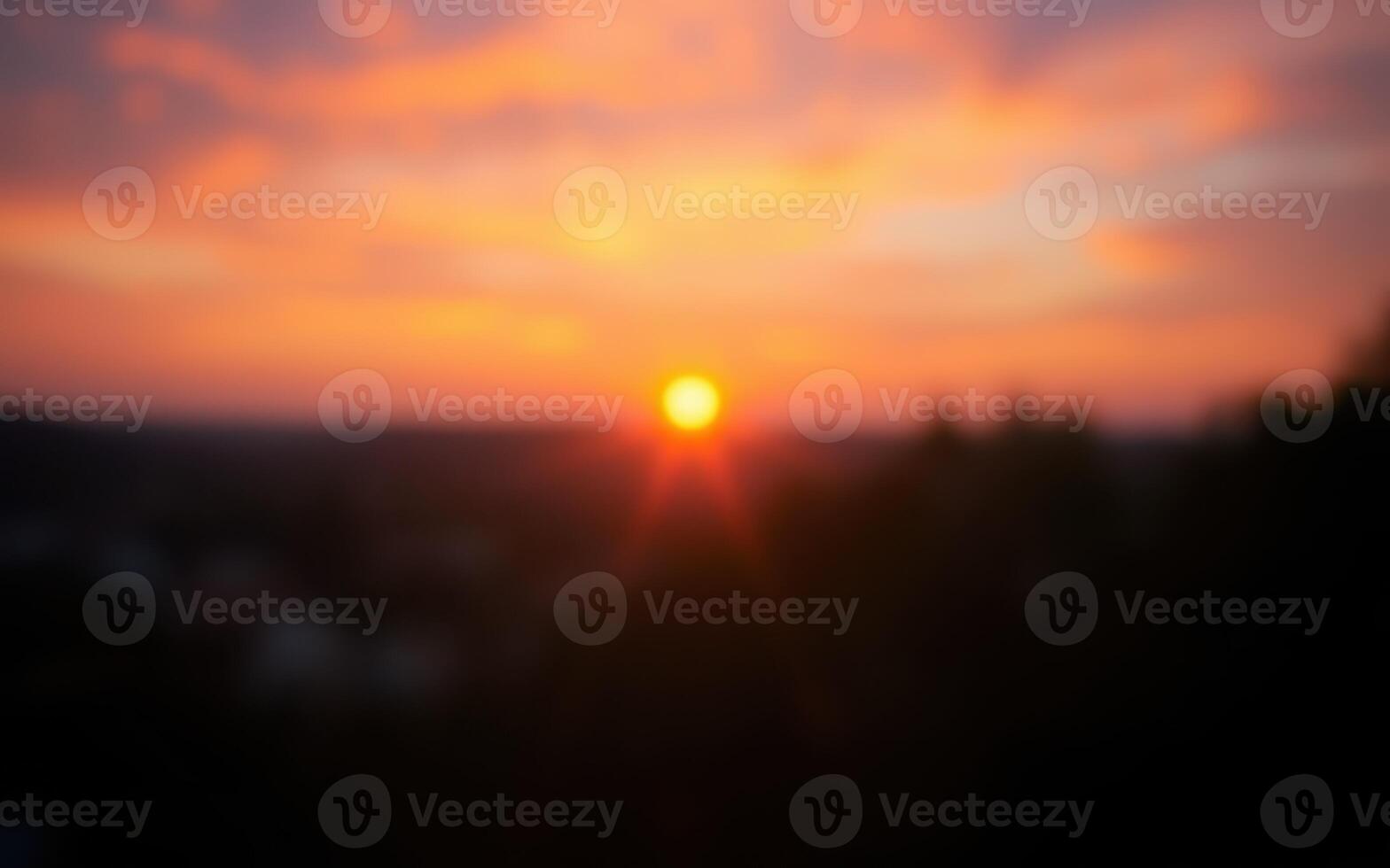 Beautiful sunset view over the horizon with vibrant colors and soft clouds in the sky photo