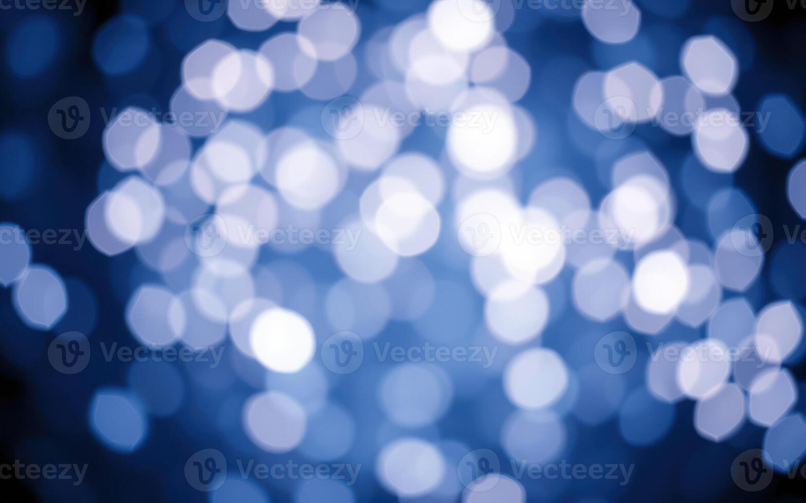 Soft blue bokeh lights create a calming atmosphere, illuminating a dark background and enhancing visual appeal for evening settings photo