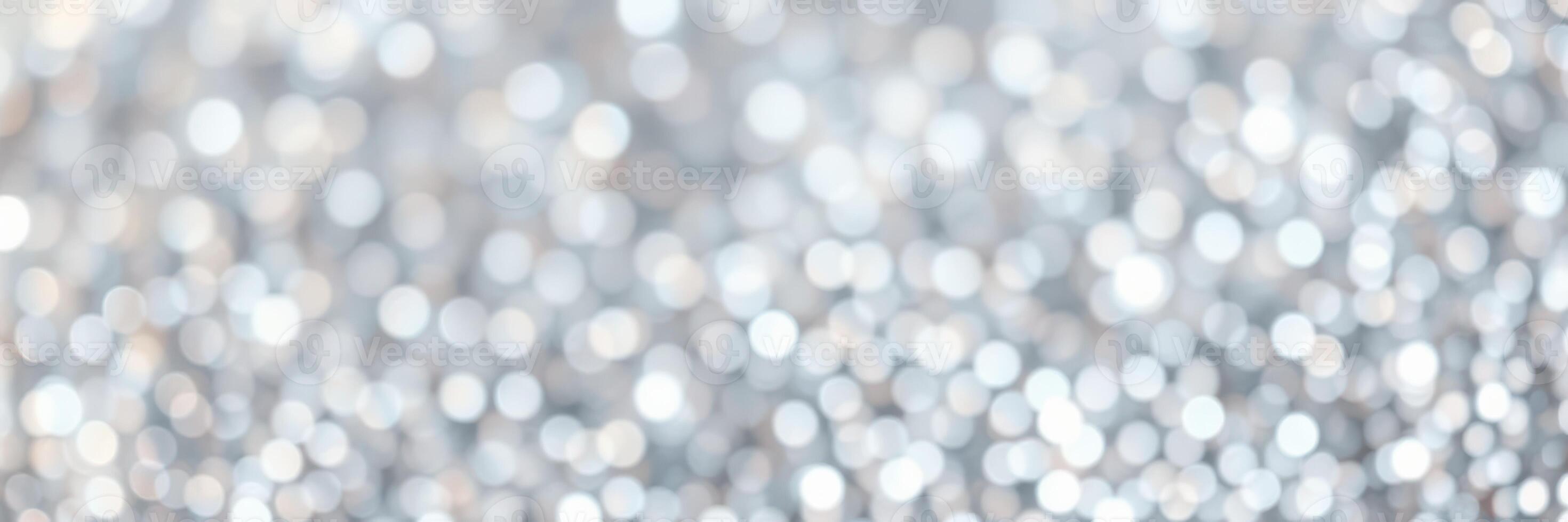Sparkling silver bokeh background creates a festive atmosphere for celebrations and events during the holiday season photo