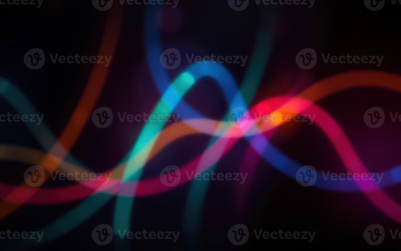 Colorful light patterns dance in abstract composition during night time display photo
