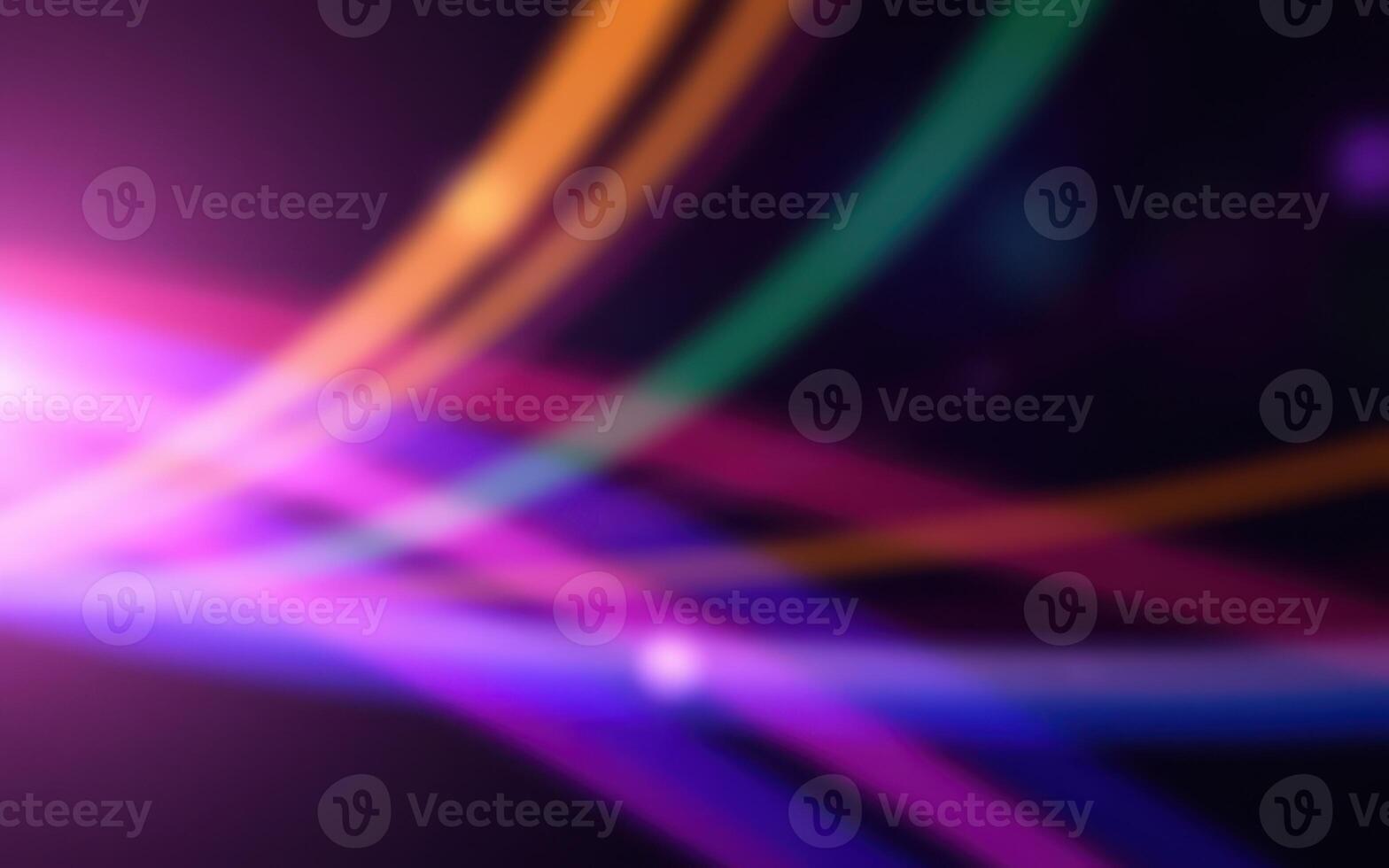 Colorful light trails create a vibrant abstract background at night for artistic expression and design purposes photo