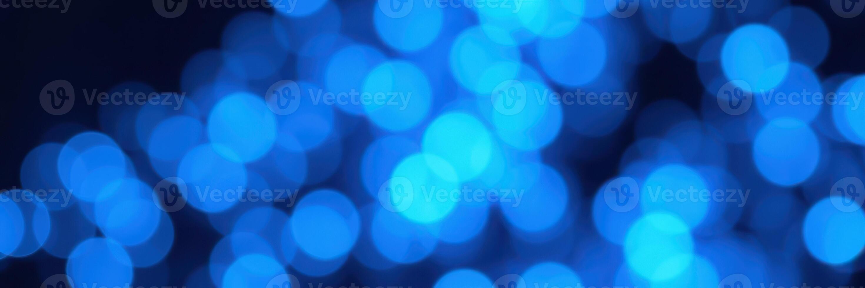 Vibrant blue bokeh lighting creates a captivating and serene atmosphere in an indoor setting photo