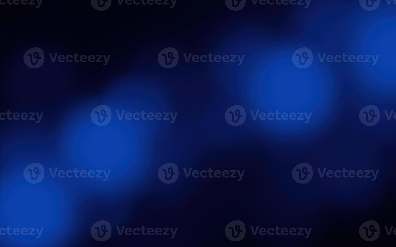 Soft blue glowing lights create a tranquil atmosphere in a dark setting for relaxation or meditation photo