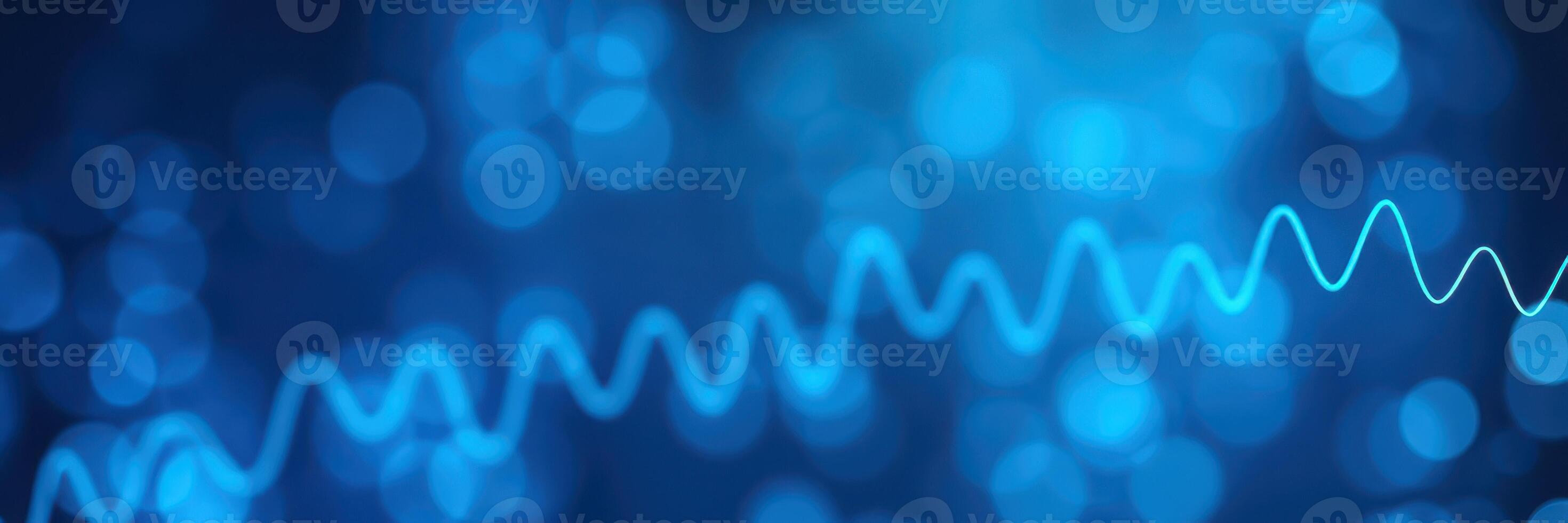 Vibrant blue light patterns create a mesmerizing effect with dynamic waves and bokeh in a digital ambiance photo