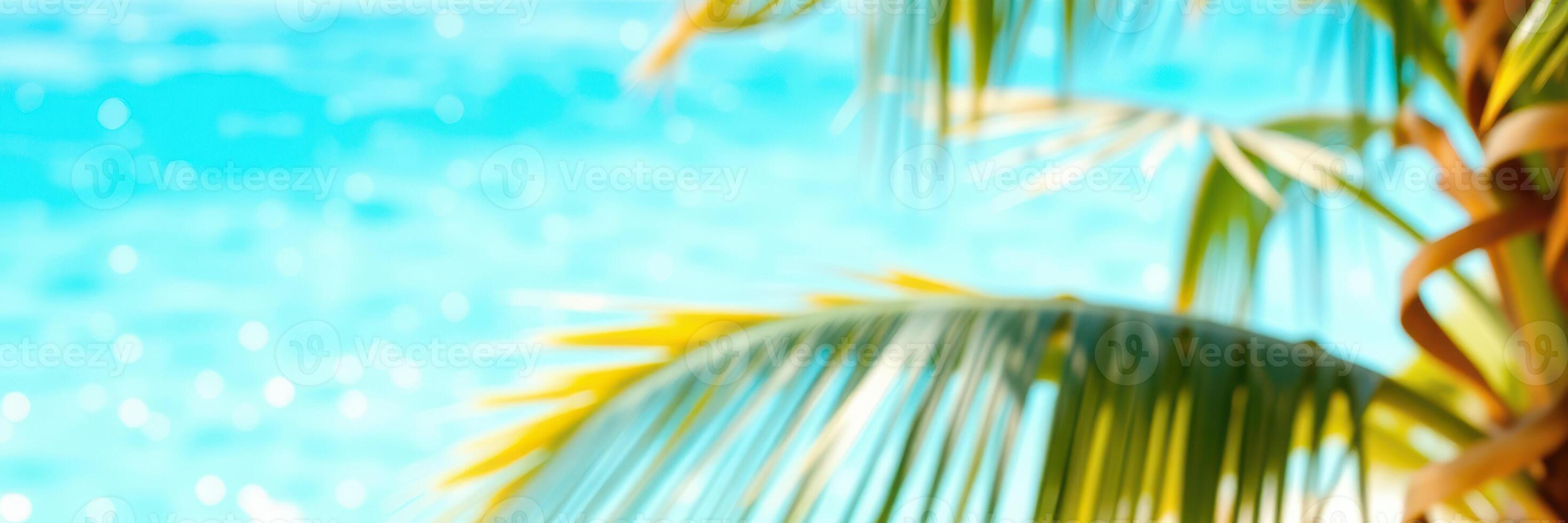 Bright tropical oasis with palm fronds swaying by the vibrant blue ocean during a sunny day photo