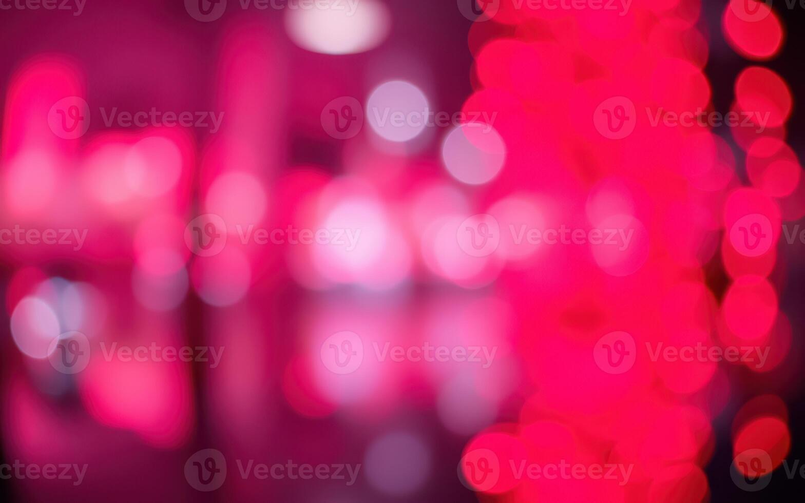 Bright abstract light patterns create a vibrant atmosphere in a lively venue during the night photo