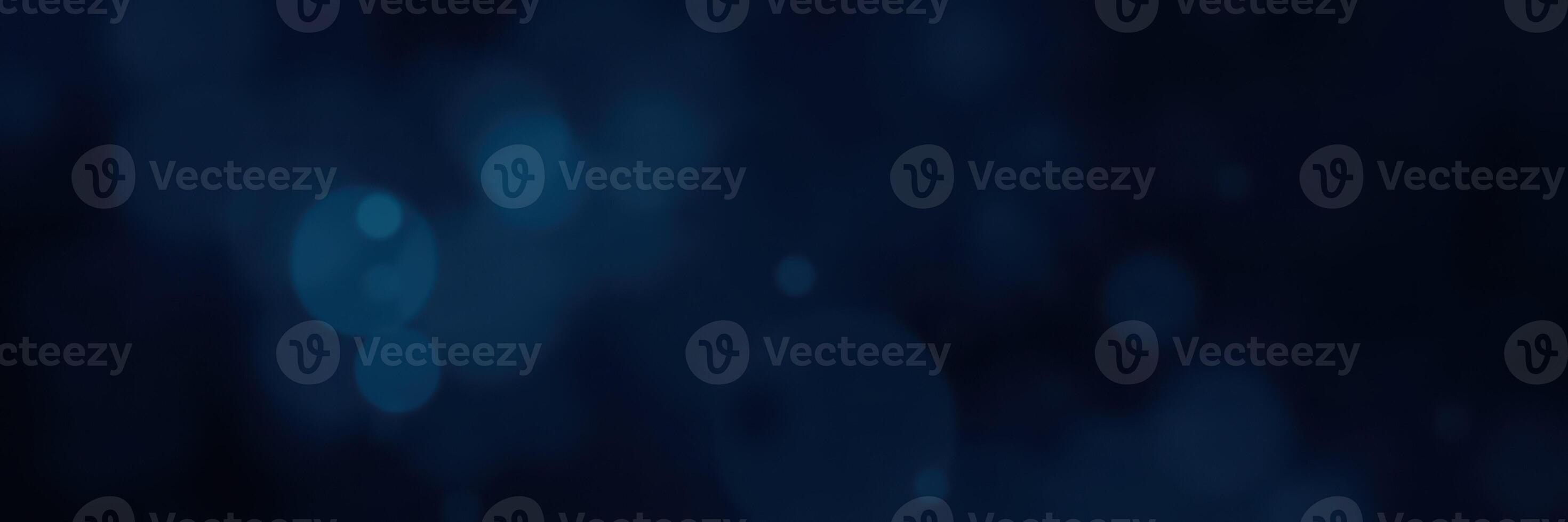 Dramatic blue and black abstract background with soft bokeh lights creating a dreamy atmosphere photo