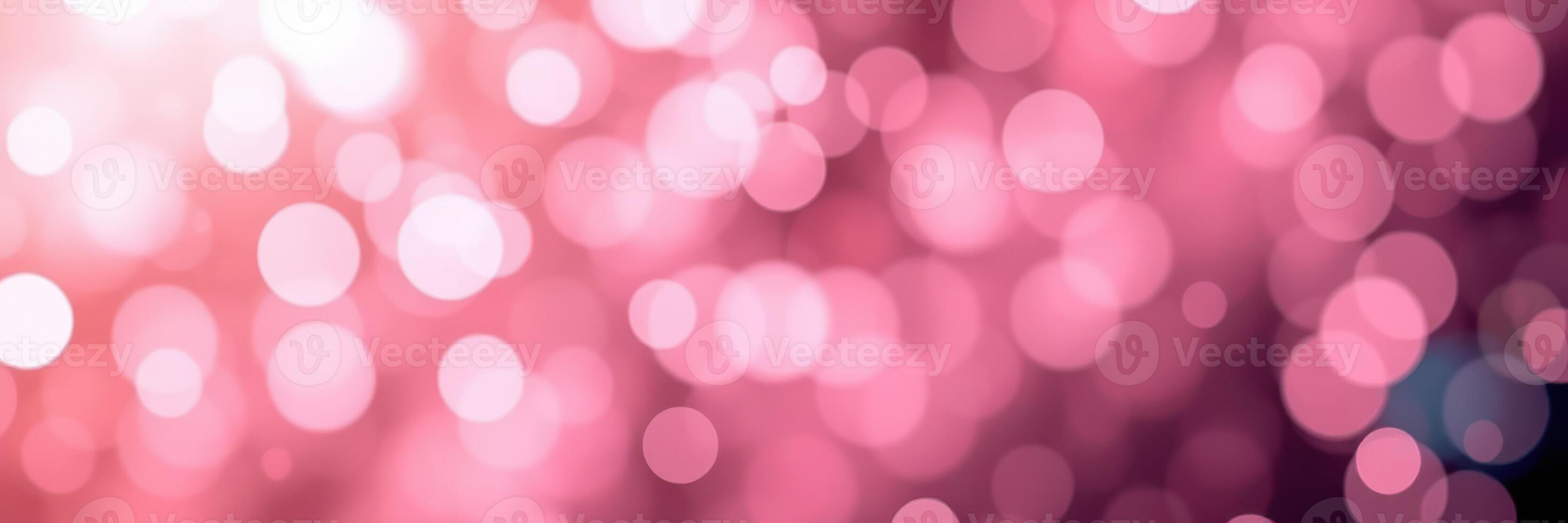 Soft pink bokeh lights create a dreamy atmosphere in a festive setting during a celebration photo